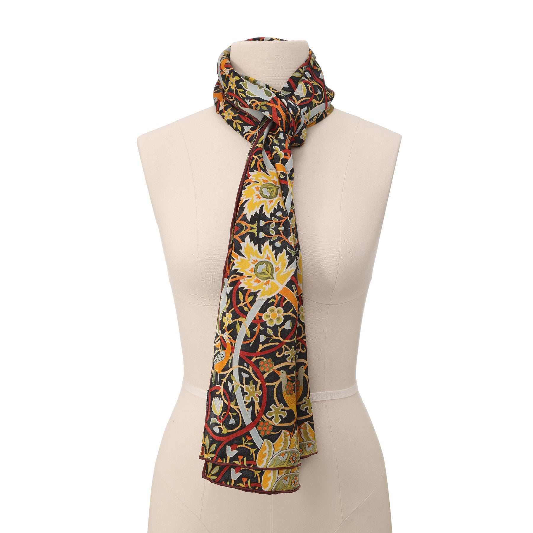 Vintage Floral Silk Scarf featuring ornate bird and bloom motifs with intricate, symmetrical patterns in gold, blue, and red tones—reminiscent of traditional decorative designs.