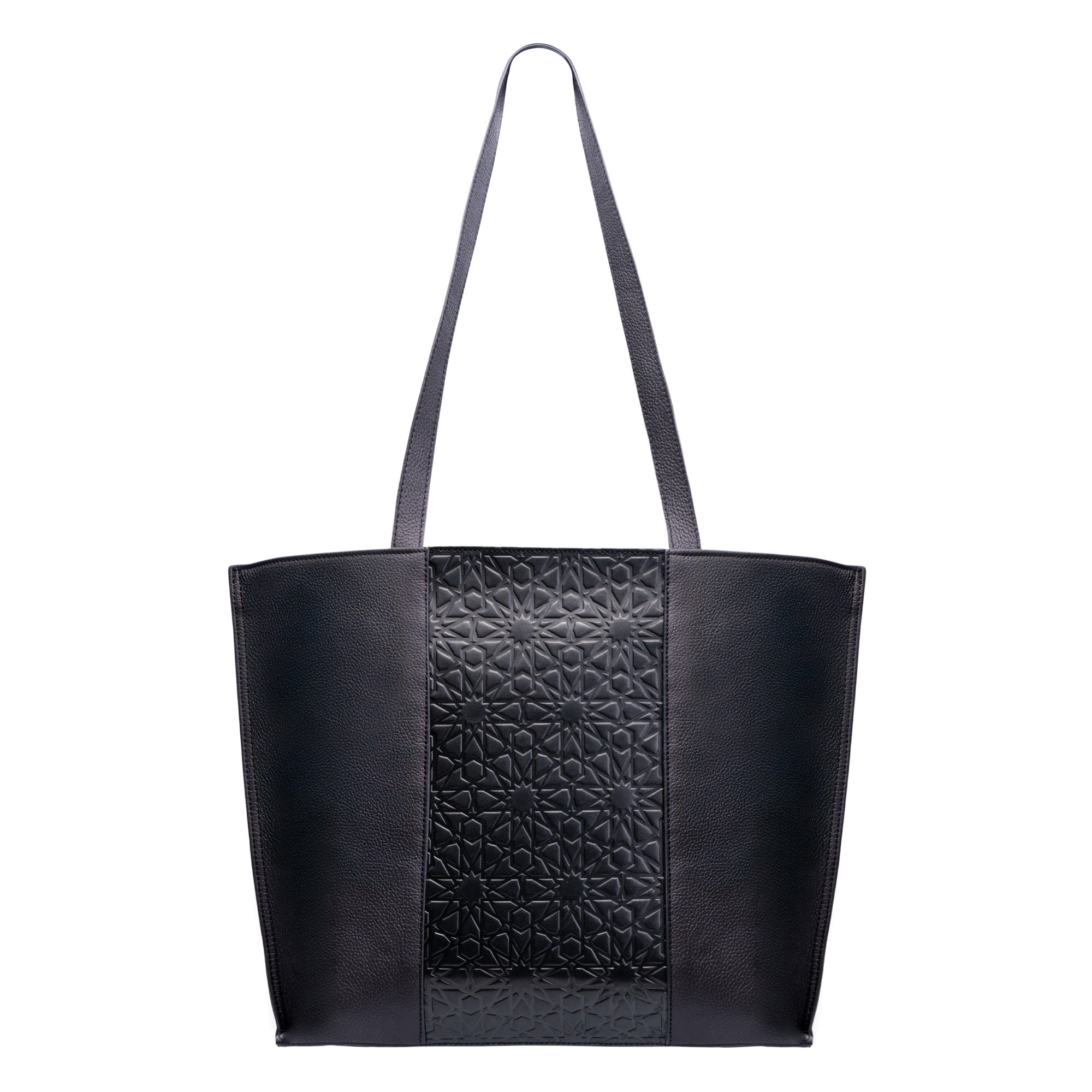 The Black Leather Tote Bag - Alhambra Pattern Embossed features a geometric central panel and smooth Spanish leather sides, with long shoulder straps for easy carrying.