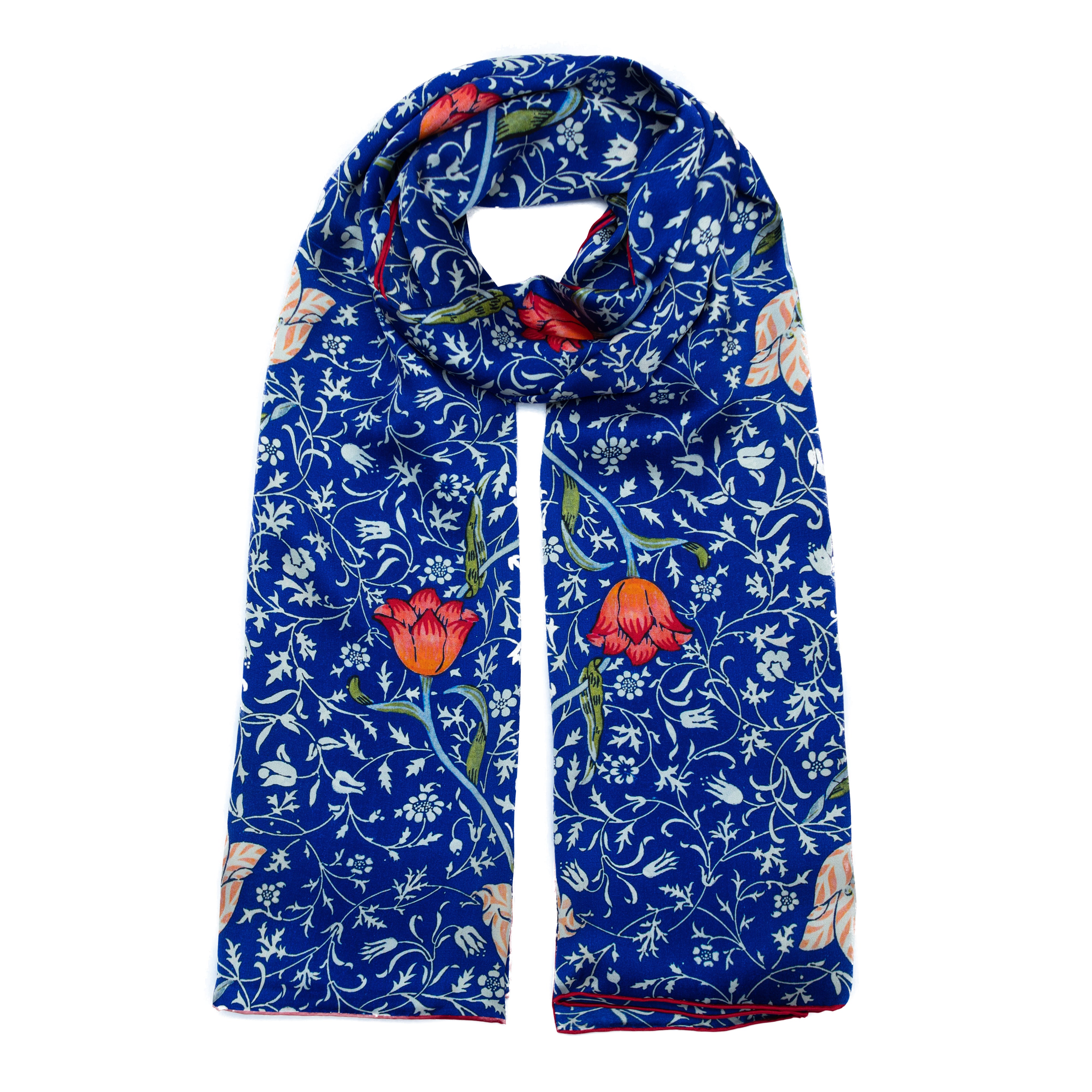 The Floral Blue Silk Scarf Galata features an Art Nouveau floral pattern with red and orange flowers, green leaves, and white vines decoratively arranged on luxurious blue silk.