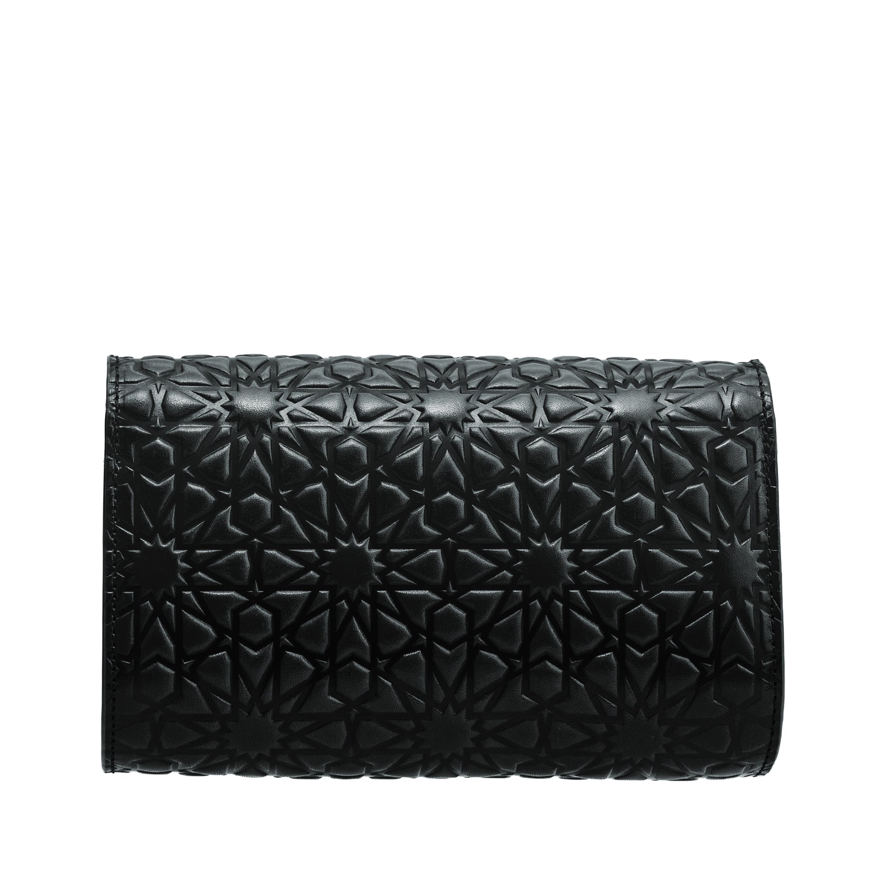 The Small Black Leather Bag Bayarcal is a handmade rectangular clutch from Spain, crafted with vegetable-tanned leather and detailed with Islamic-inspired geometric star embossing, shown on a white background.