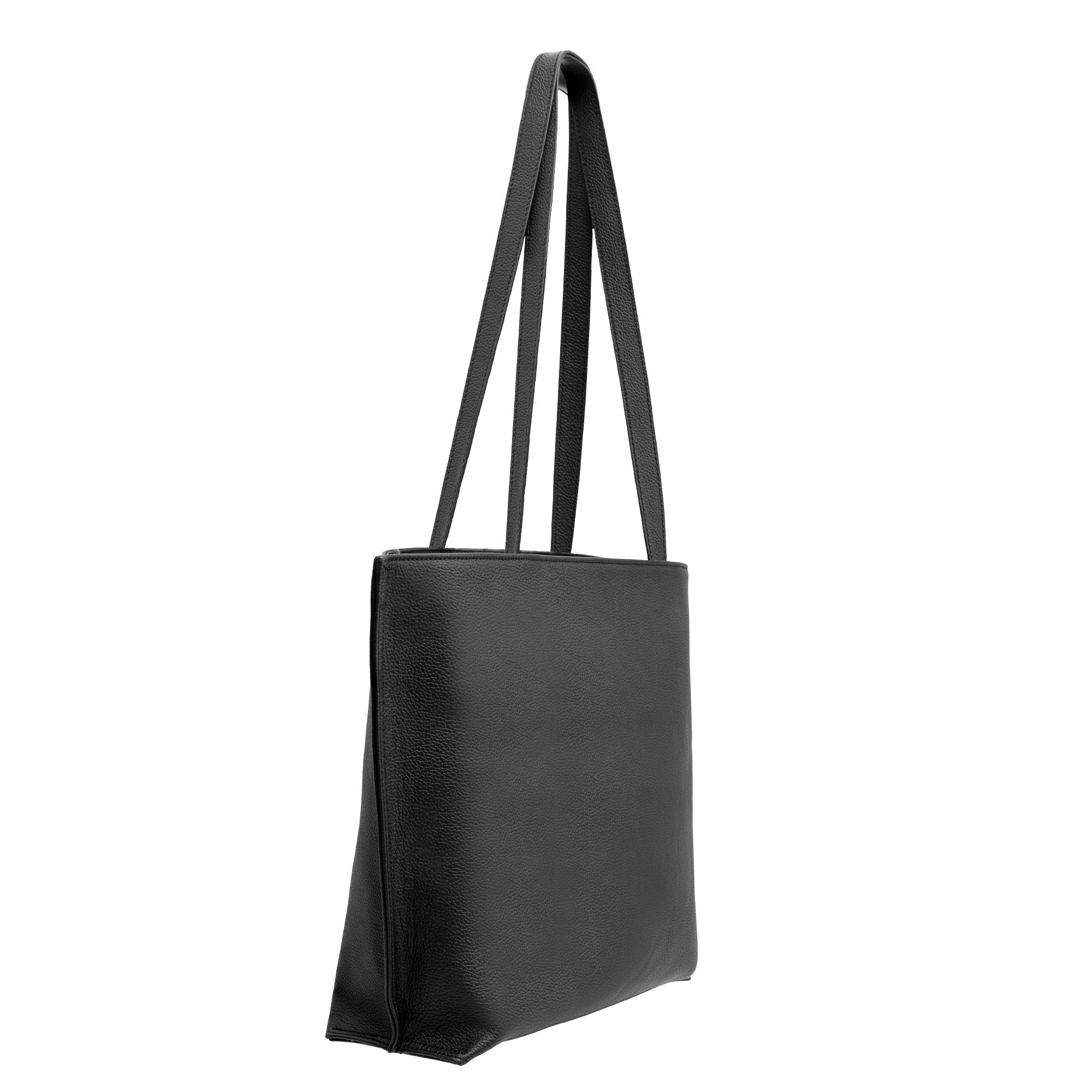 The Black Leather Tote Bag - Alhambra Pattern Embossed features premium Spanish leather, two long shoulder straps, and elegant geometric embossing, shown angled on a white background.