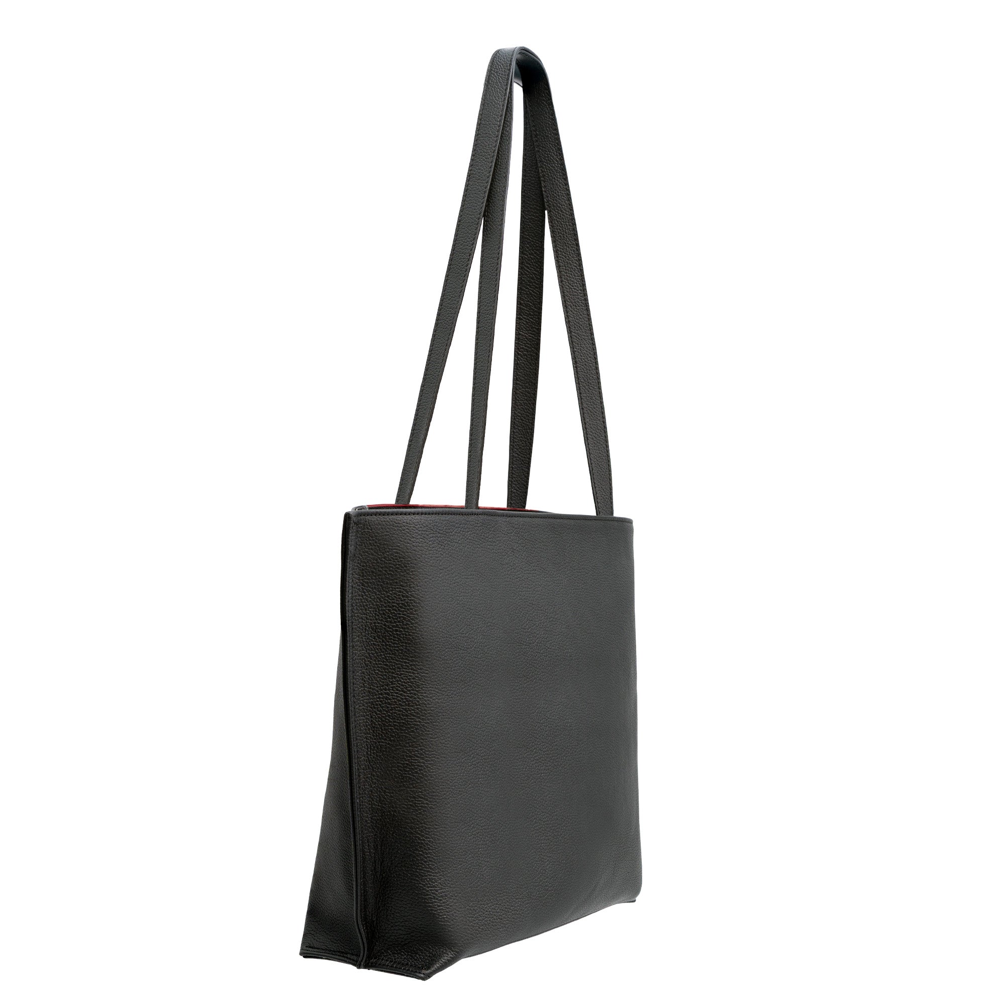 A red and black leather tote bag with an Islamic art embossed pattern, featuring two long shoulder straps, is shown at an angle against a white background.