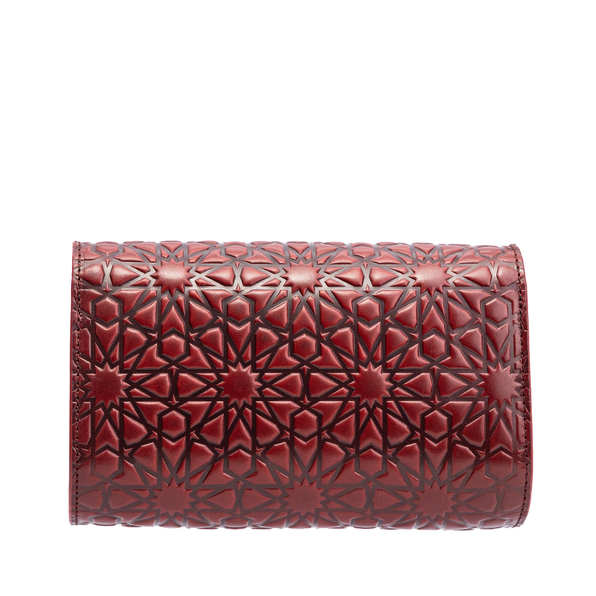 The Small Burgundy Leather Bag Bayarcal, handmade from vegetable-tanned leather, features an embossed geometric star pattern inspired by Islamic art and is shown from the front against a white background.