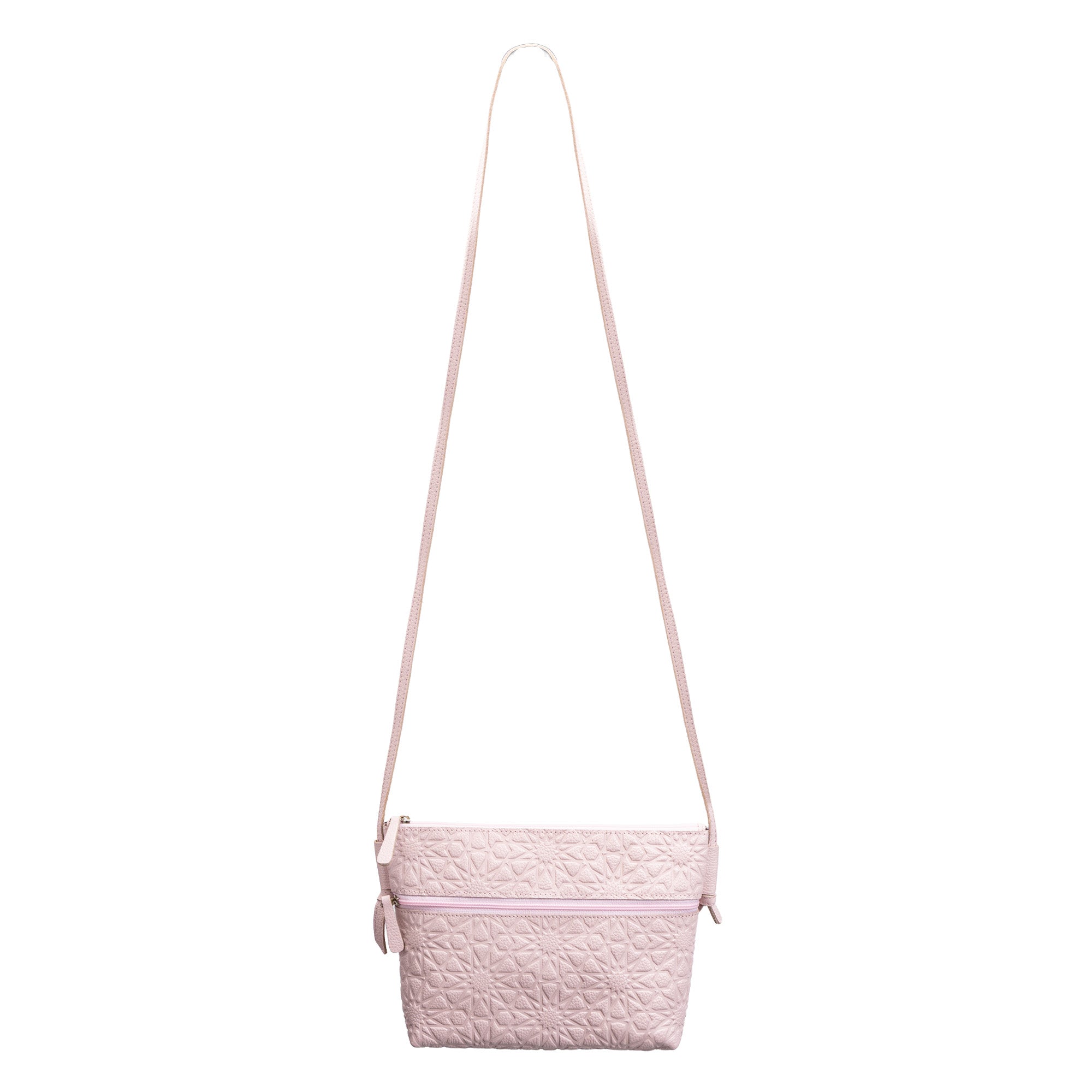 The Pale Pink Embossed Crossbody Bag features a quilted leather design, long adjustable strap, zipper closure, and an elegant Islamic pattern for added charm.