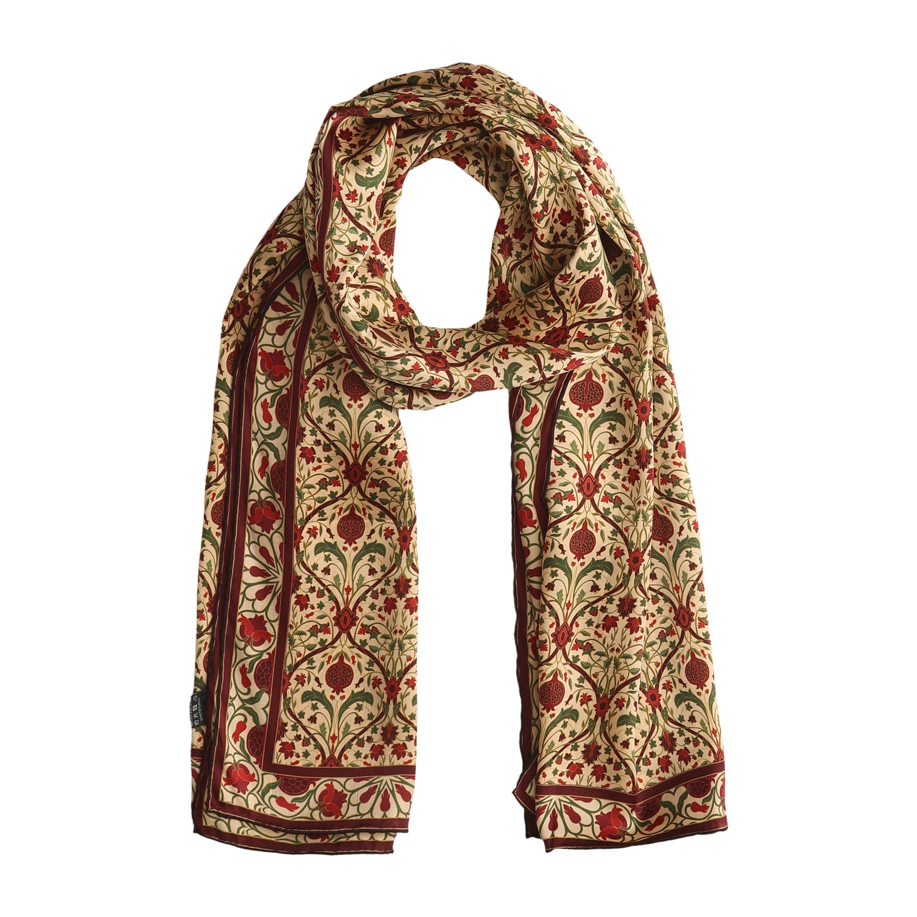 The Art Nouveau Silk Scarf Berry features an intricate floral print in red, green, and gold on a cream background, symmetrically arranged and bordered with a decorative Art Nouveau-inspired edge.