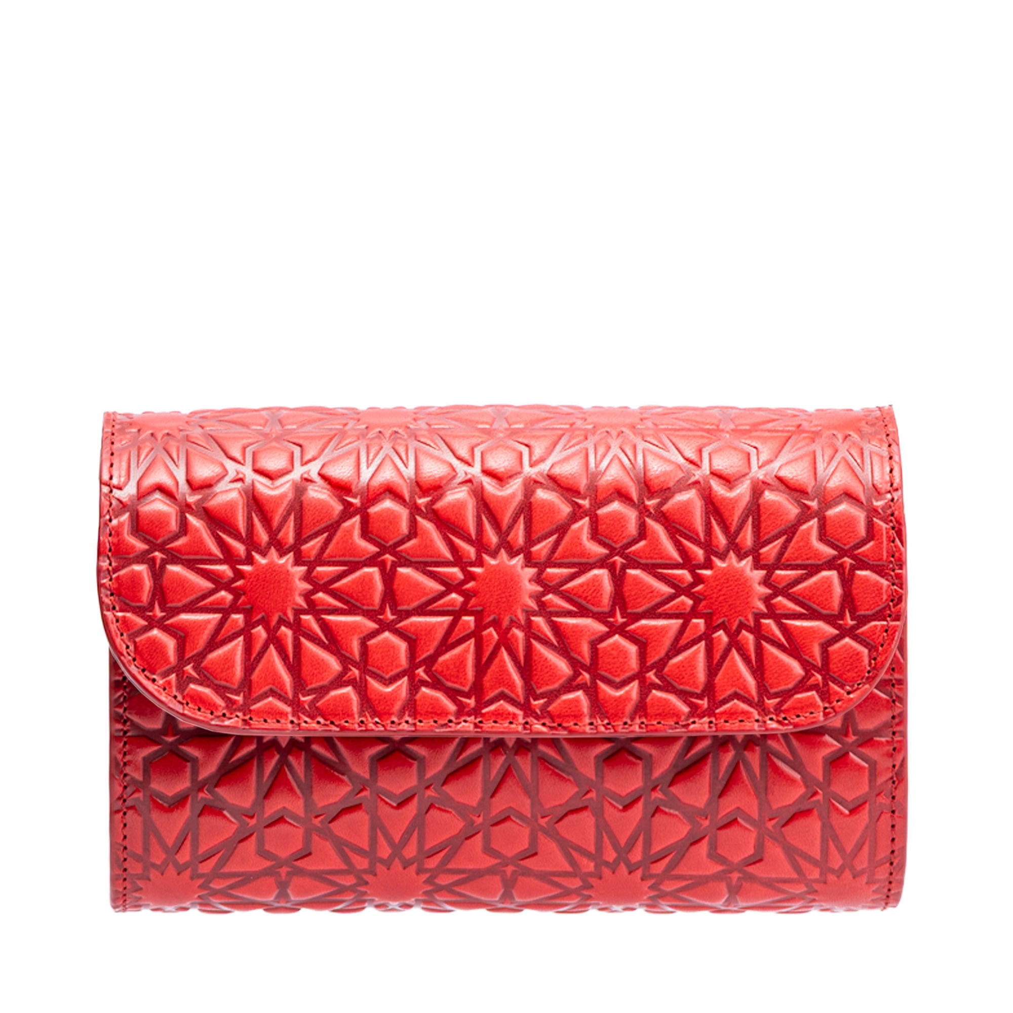 The Small Leather Hand Bag Red - Bayarcal is made from vegetable-tanned leather and features geometric star embossing, shown against a white background.