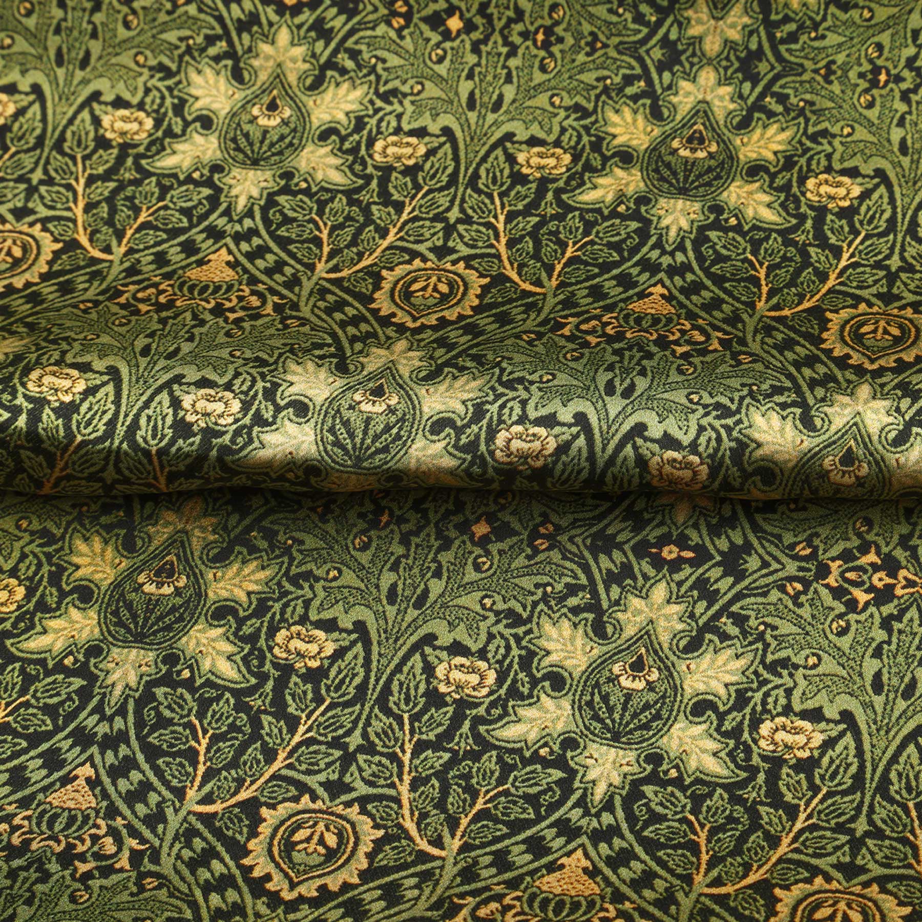 A black rectangular box with a window displays the Vintage Green Silk Scarf with Ornate Gold Motifs. HAMZAH is printed at the top, and Wrap yourself in elegance appears in cursive at the bottom.
