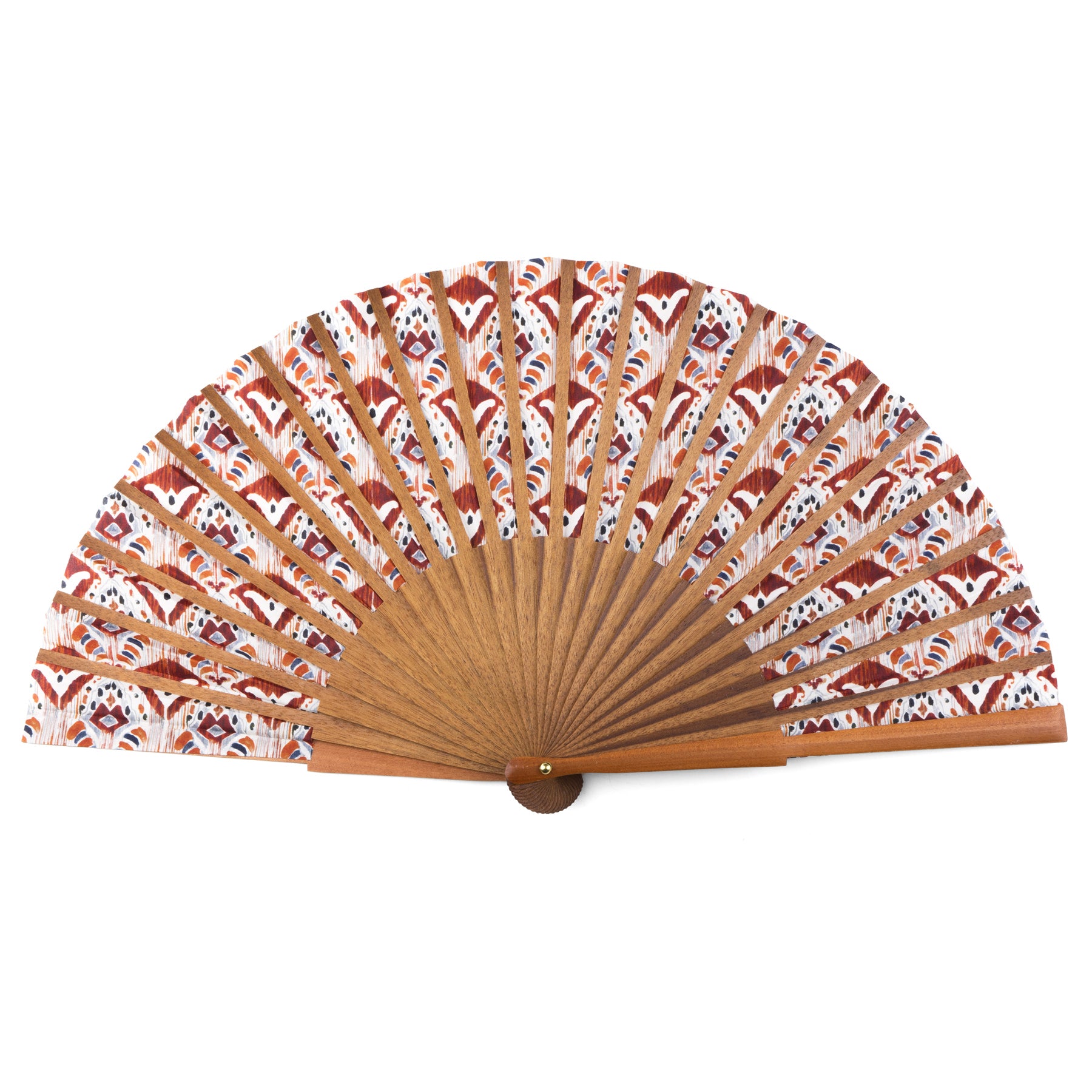 The Ikat-Inspired Silk Fan, handmade in Spain with Bocapi wood, features a brown frame and patterned silk in red, brown, and white Ikat designs. It’s shown fully open against a white background.