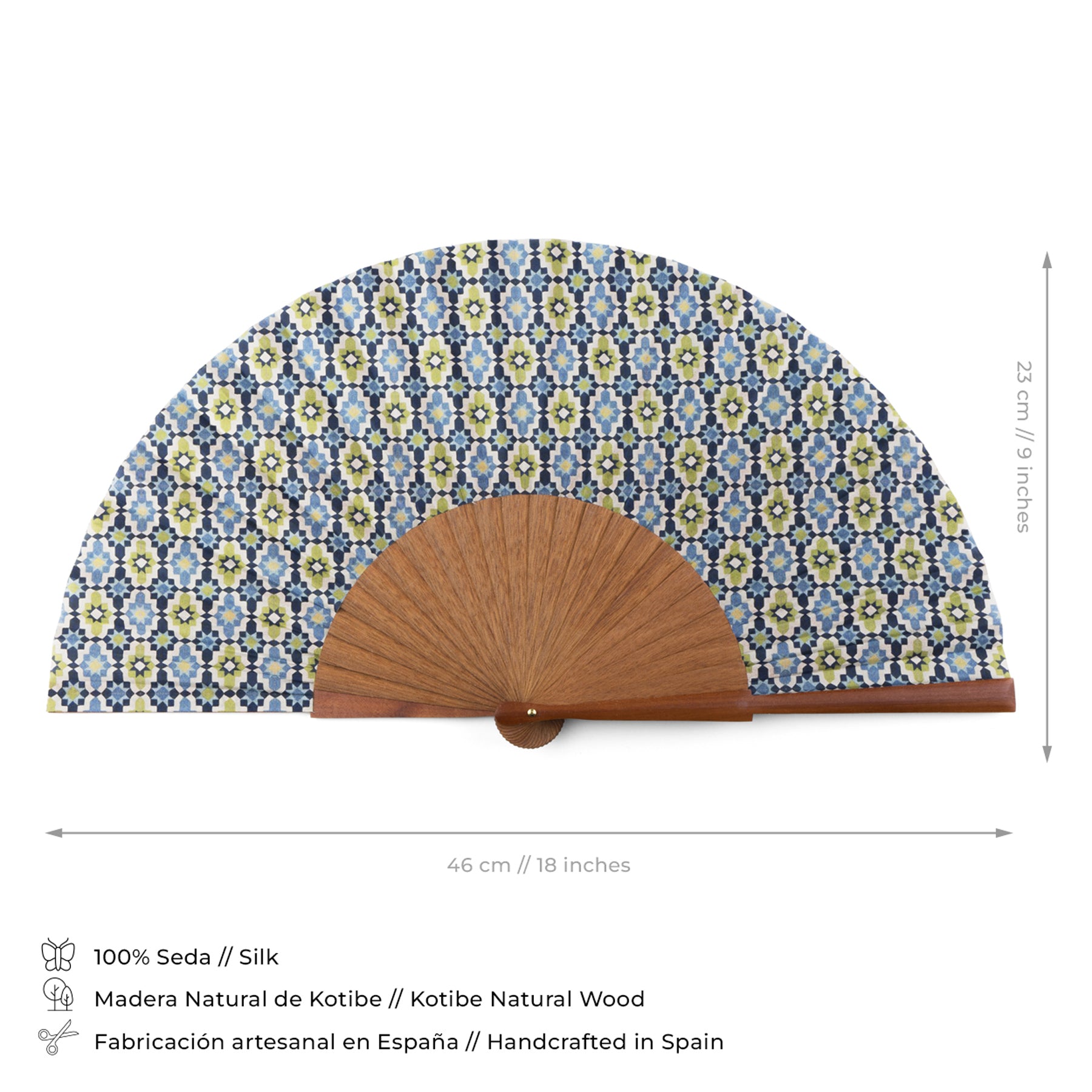 The Blue & Green Silk hand fan Ayad, handmade in Spain from silk and Kotibe wood, measures 46 cm wide by 23 cm tall and features a blue, green, and white geometric Moroccan tile print on silk with a natural wood base.