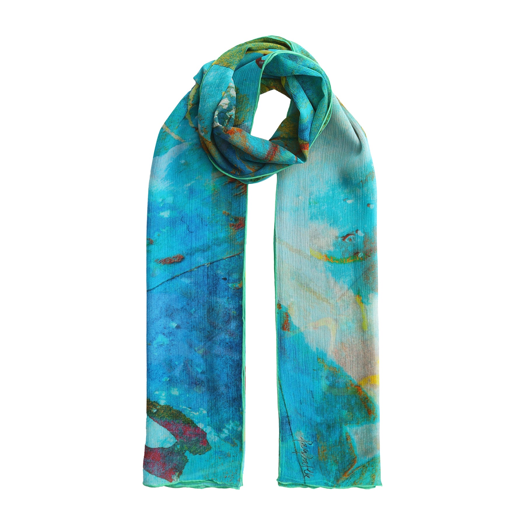 The Multicolor Silk Scarf Oxido Marino is a long, lightweight muslin silk piece featuring an abstract design in blue, green, yellow, and red—adding vibrant style to any look against a white background.