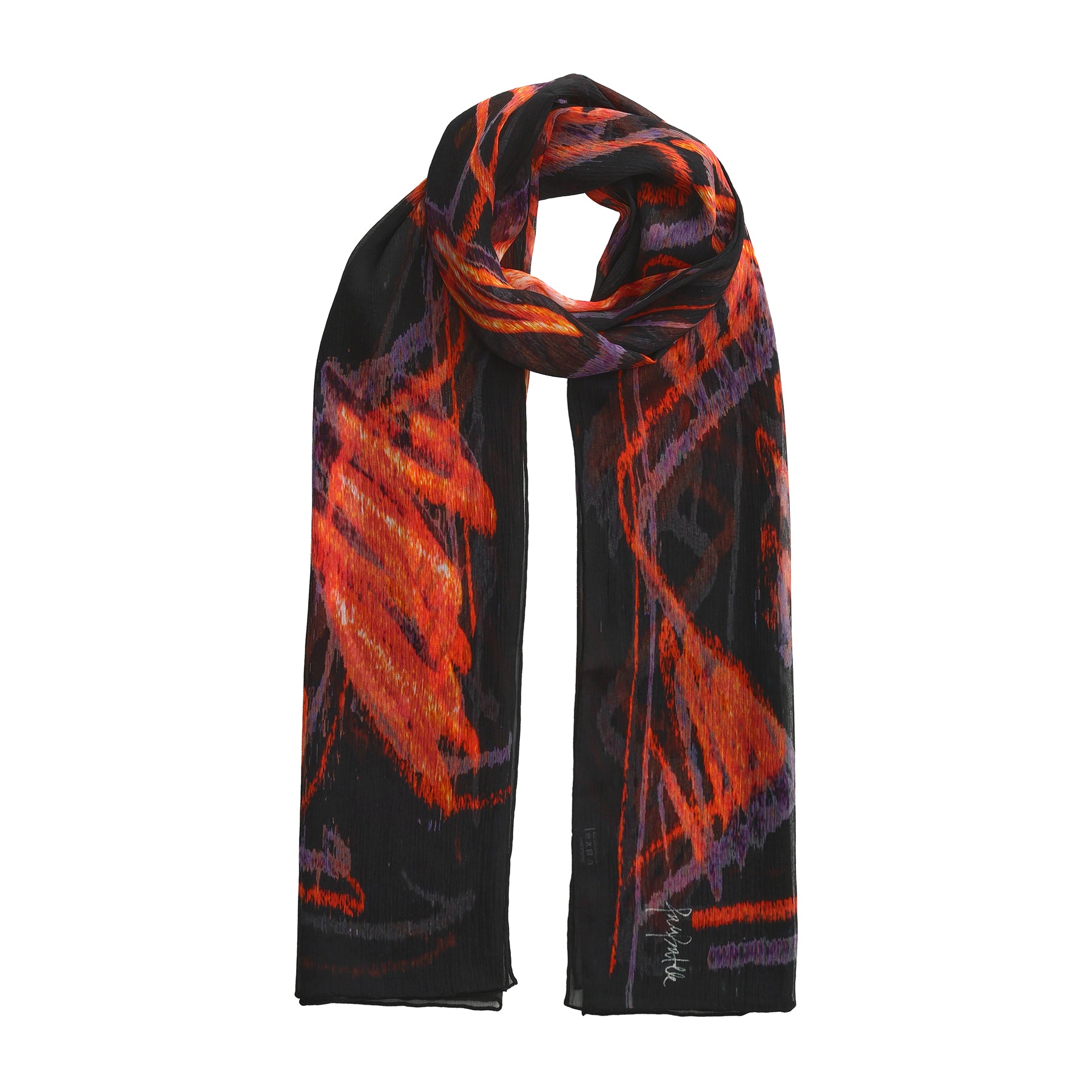 The Black & Red Silk Scarf Anubis is a black muslin silk scarf with striking red, orange, and purple abstract patterns. Carefully arranged with one end looped over, it highlights the vibrant wearable artwork of this unique piece.