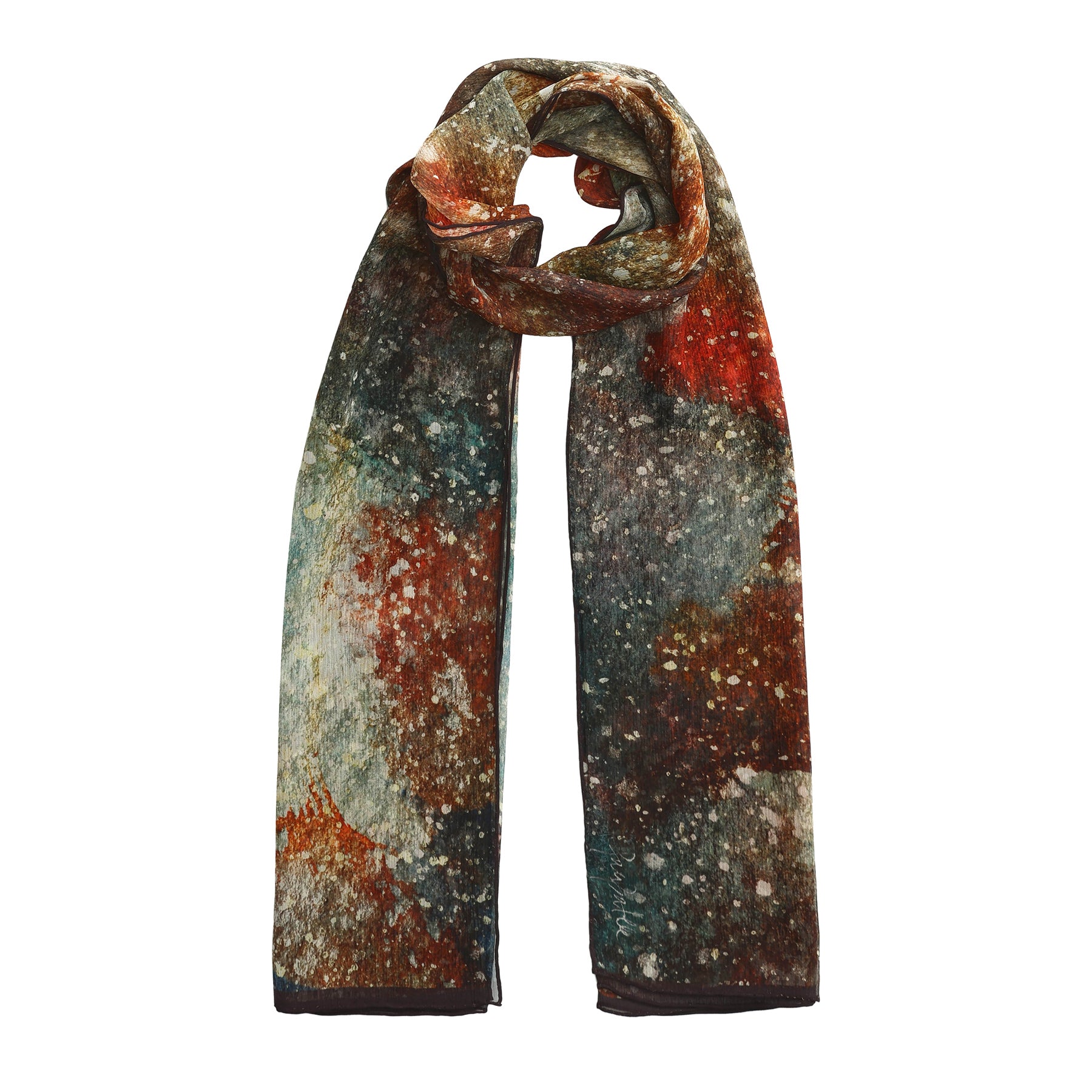The Multicolor Silk Scarf Polvo Cósmico features a long muslin silk design with an abstract, painterly speckled pattern in red, brown, green, and white—a wearable artwork neatly looped at the top.