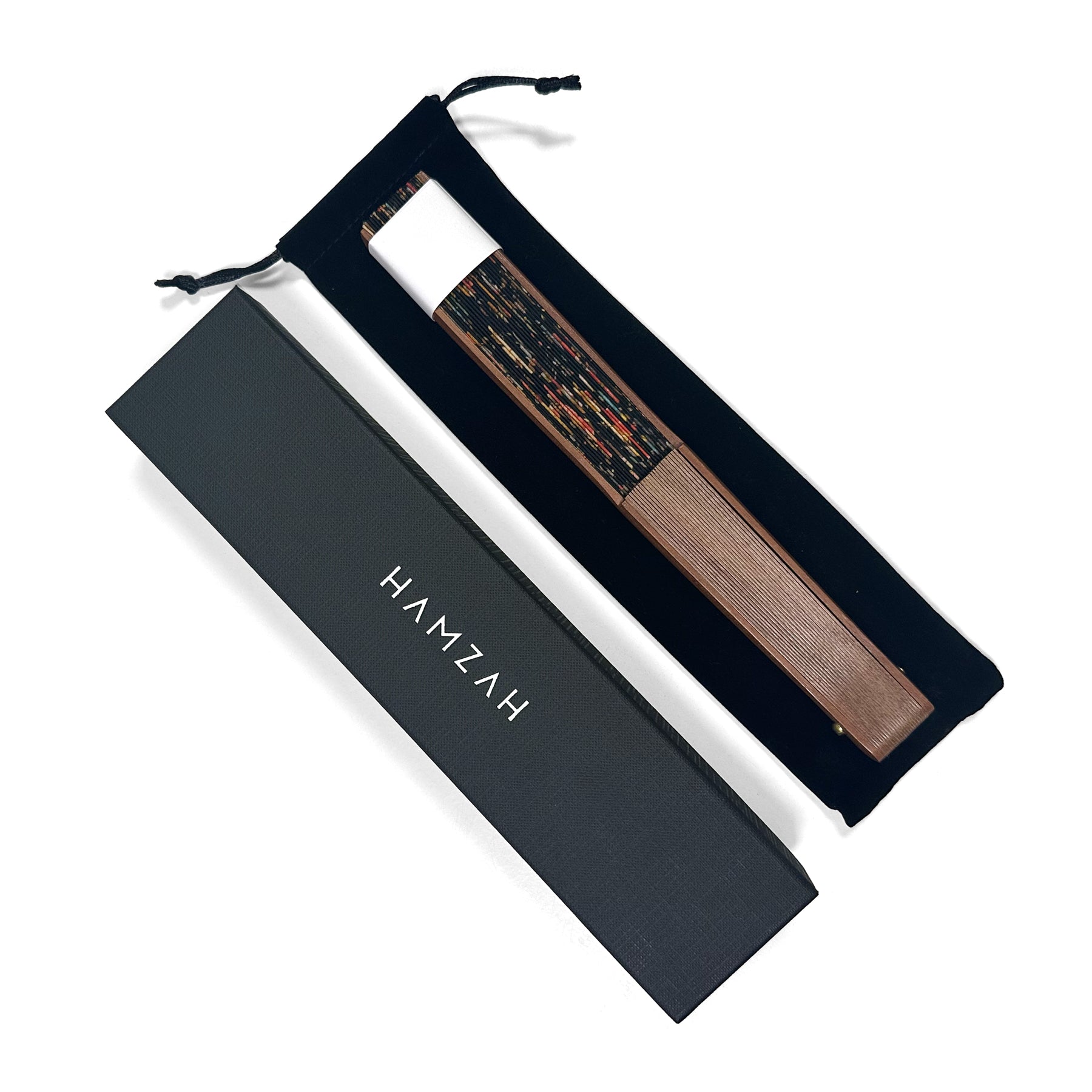 Silk hand fan packaging from Hamzah in black colors with white logo