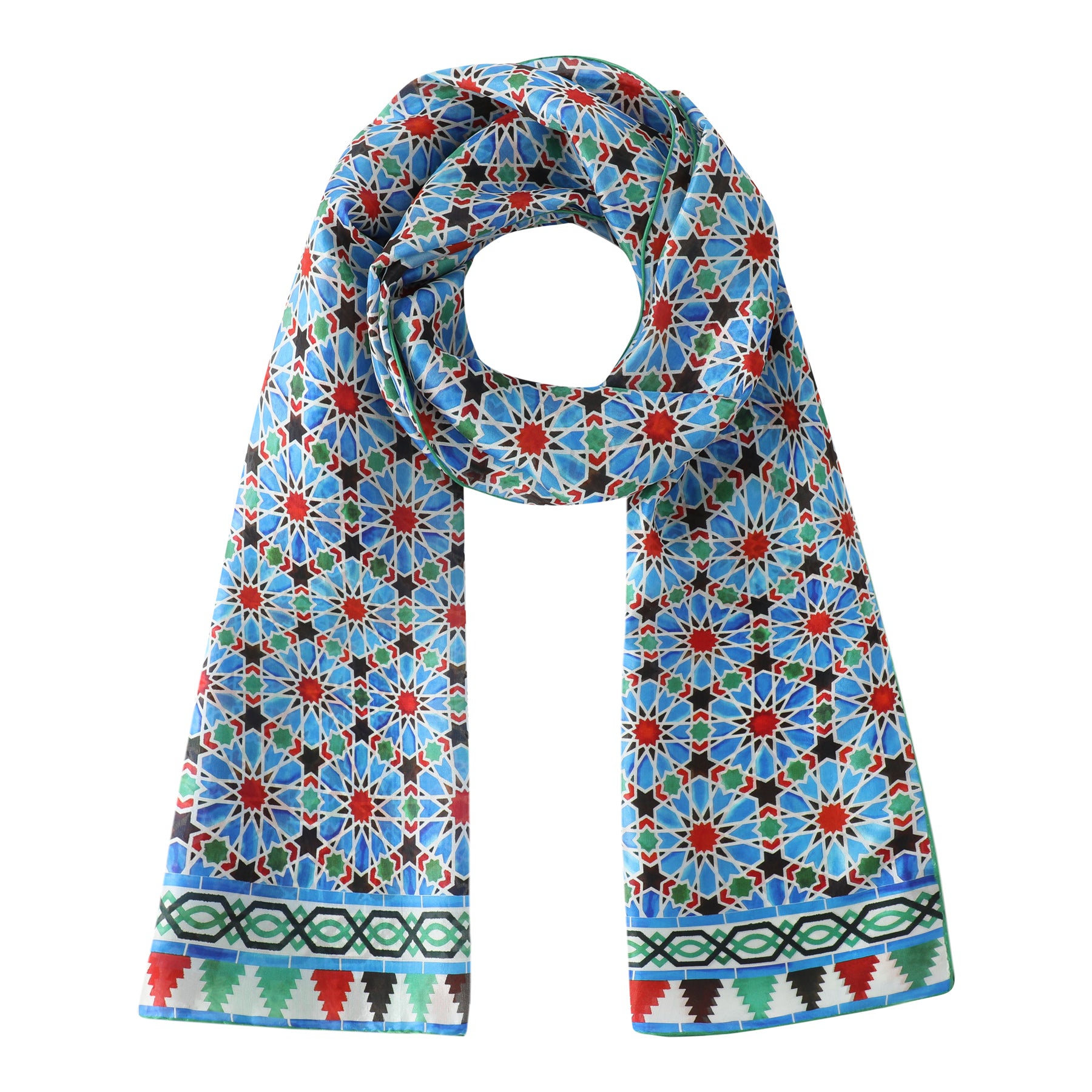 The Blue and Red Silk Scarf Zellige features a vibrant blue base with a colorful mosaic-inspired geometric pattern, including red, white, and green shapes, and a decorative border with triangular and diamond designs.