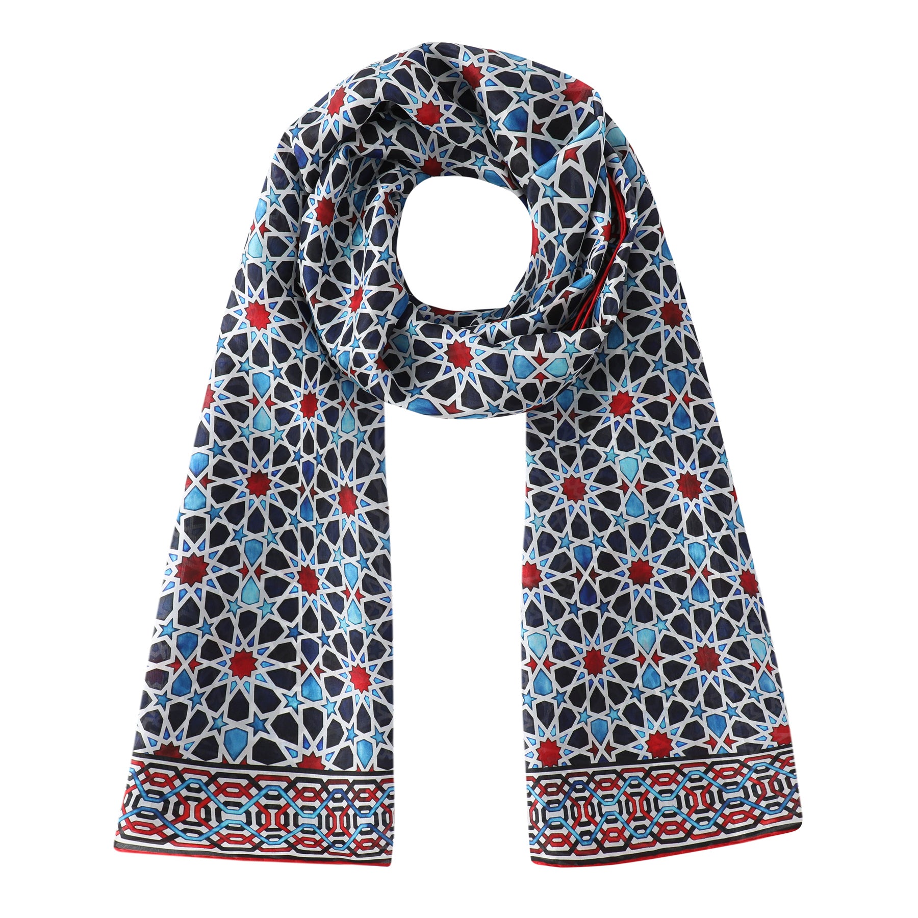 The Alhambra Inspired Silk Scarf Fatima features an intricate blue, white, and red geometric pattern with a matching motif border, echoing handmade mosaic designs in an elegant, timeless style.