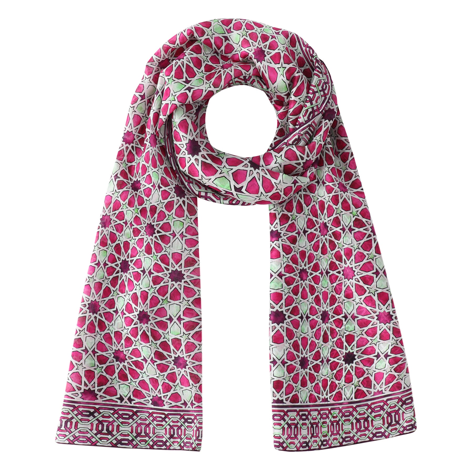 The Long Pink Silk Scarf Fatima is a silk blend scarf with an intricate geometric pattern in pink, red, and green, featuring symmetrical floral motifs and a mosaic-inspired border, shown arranged in a loop.
