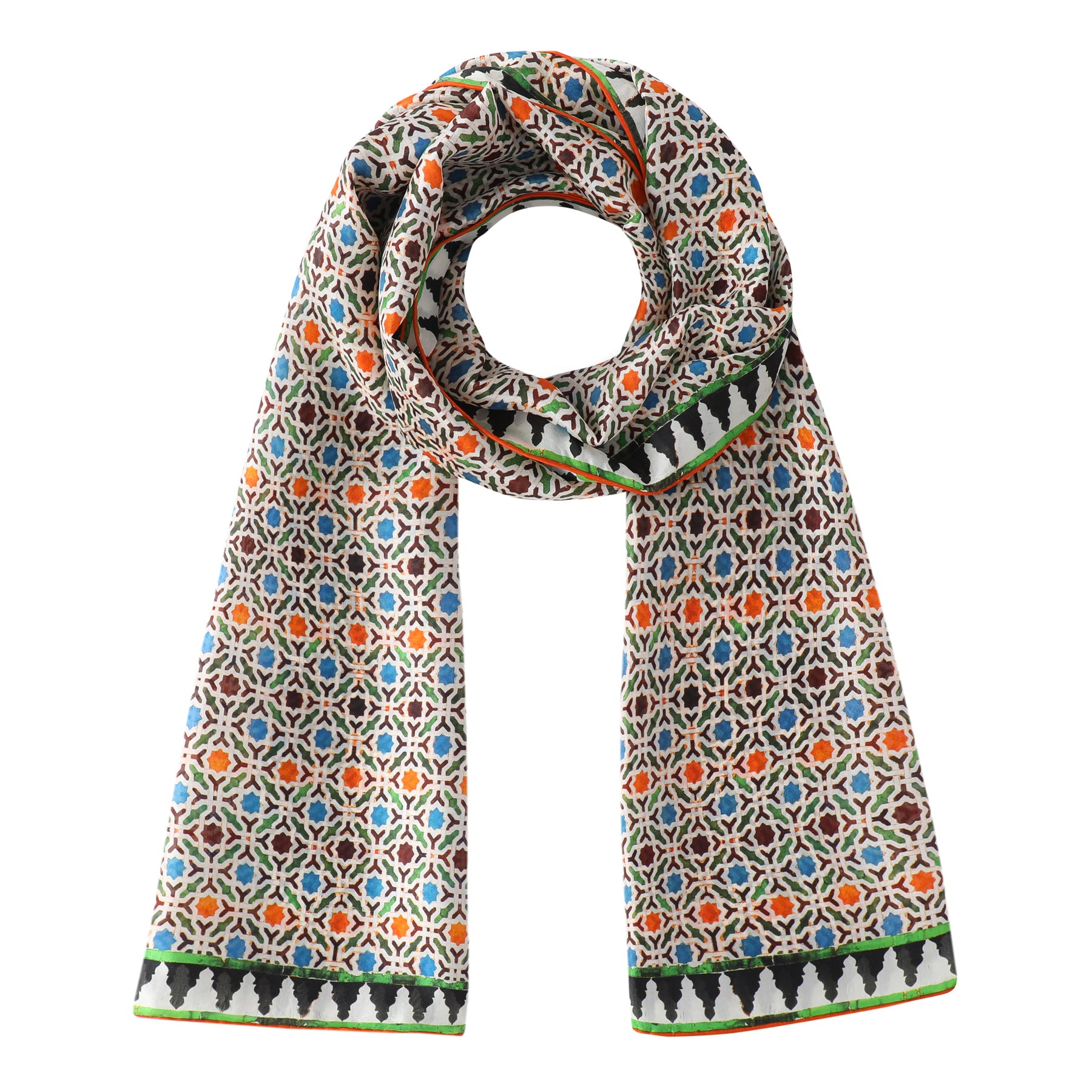 The Colorful Silk Scarf with Geometric Print Nazarí features a vibrant geometric pattern inspired by Islamic art tiles in blue, orange, green, and black. Tree-like border designs on a light background add unique detail. The scarf is loosely looped at the top.