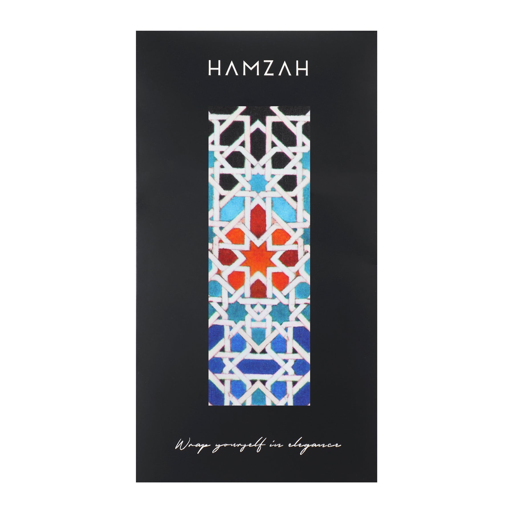 The Multicolored Silk Scarf Madiya, featuring a geometric Islamic art pattern in white, red, blue, and black silk, is displayed on black packaging with the HAMZAH brand above and Wrap yourself in elegance below.