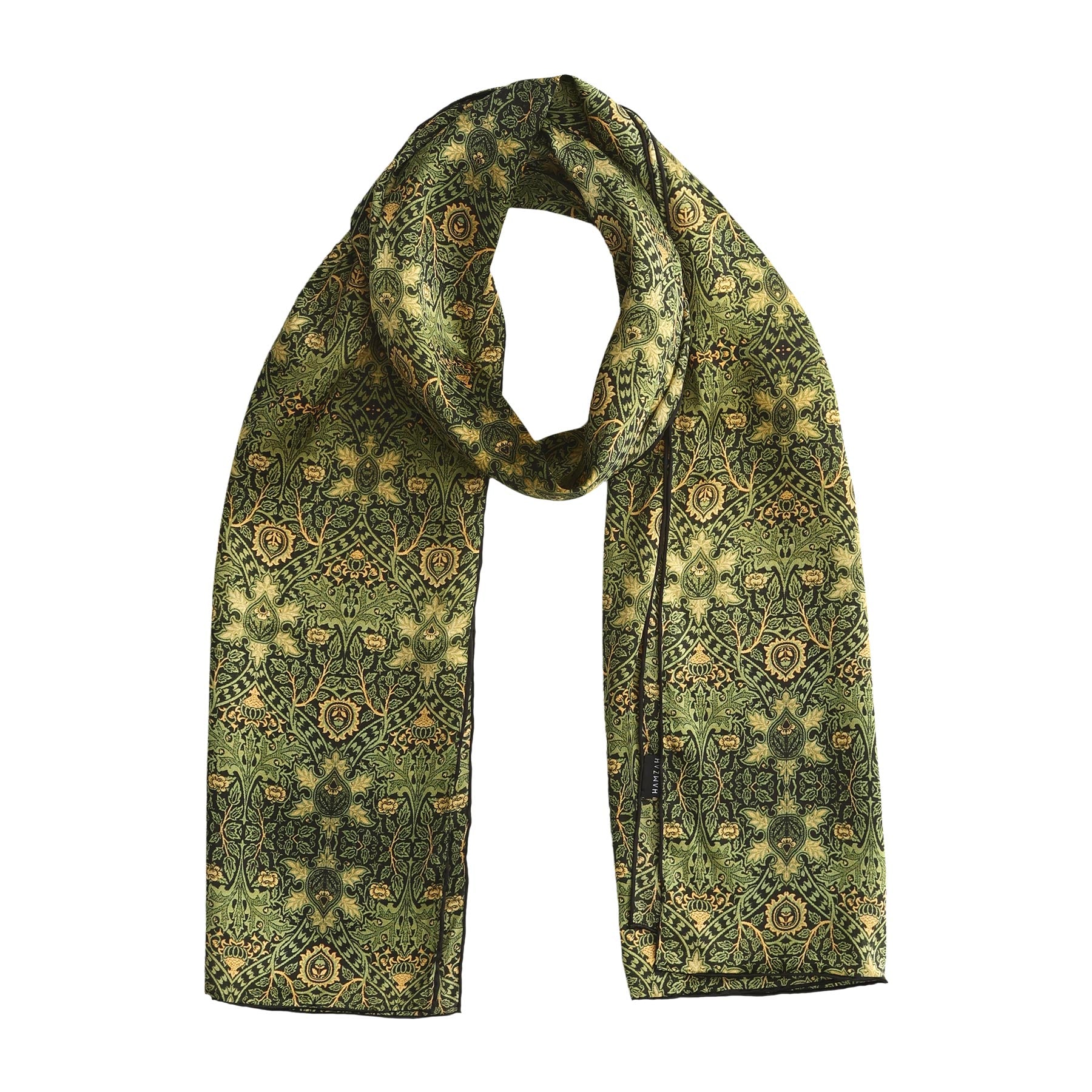 Long green silk scarf draped gracefully, featuring a timeless floral design in golden hues for a refined vintage look.