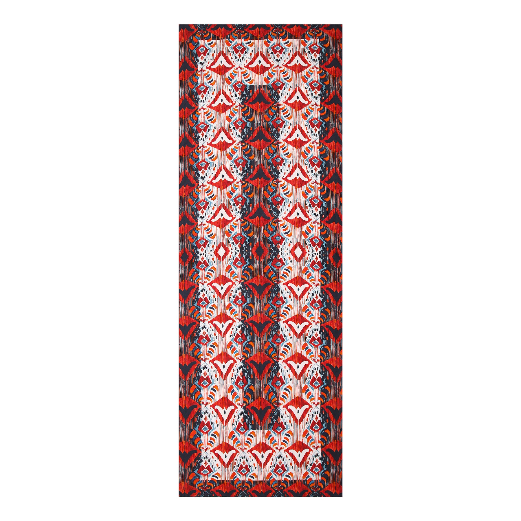 The Red and Blue Silk Scarf with Ikat Print features an intricate, symmetrical pattern in red, blue, black, and white, inspired by Indonesian designs. Its vibrant repeating floral and geometric motifs evoke classic ethnic elegance.