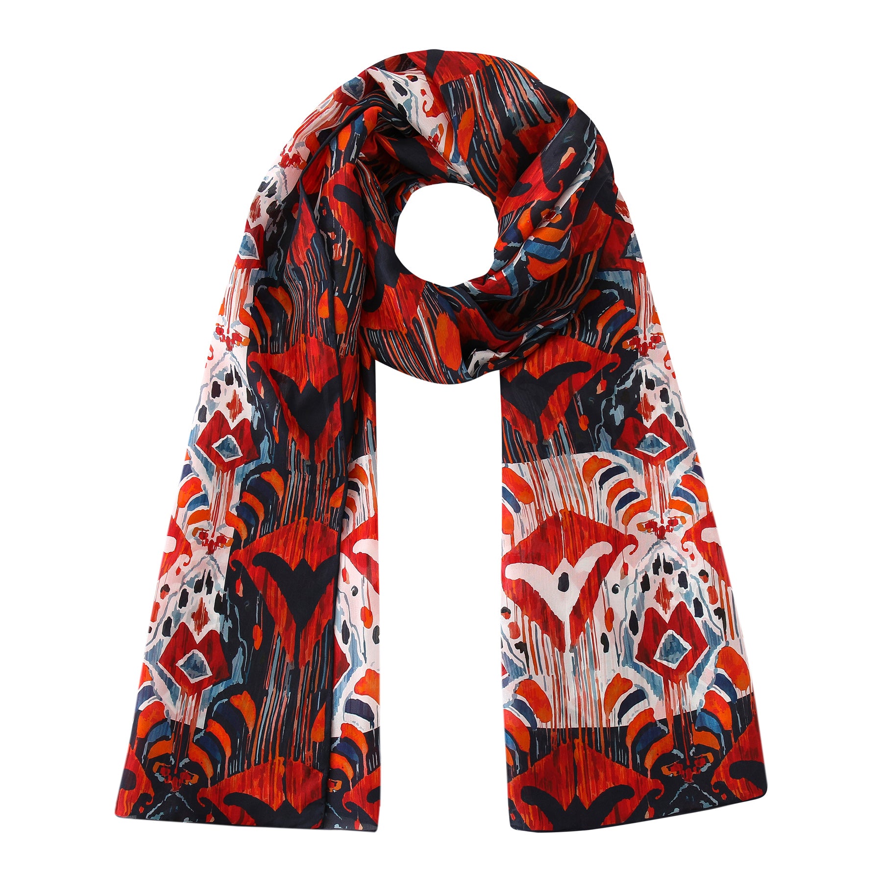 The Red and Blue Silk Scarf with Ikat Print features a bold, abstract ethnic-inspired pattern in red, black, white, blue, and orange. Its long rectangular silk shape is neatly looped to highlight the vibrant artistic design.