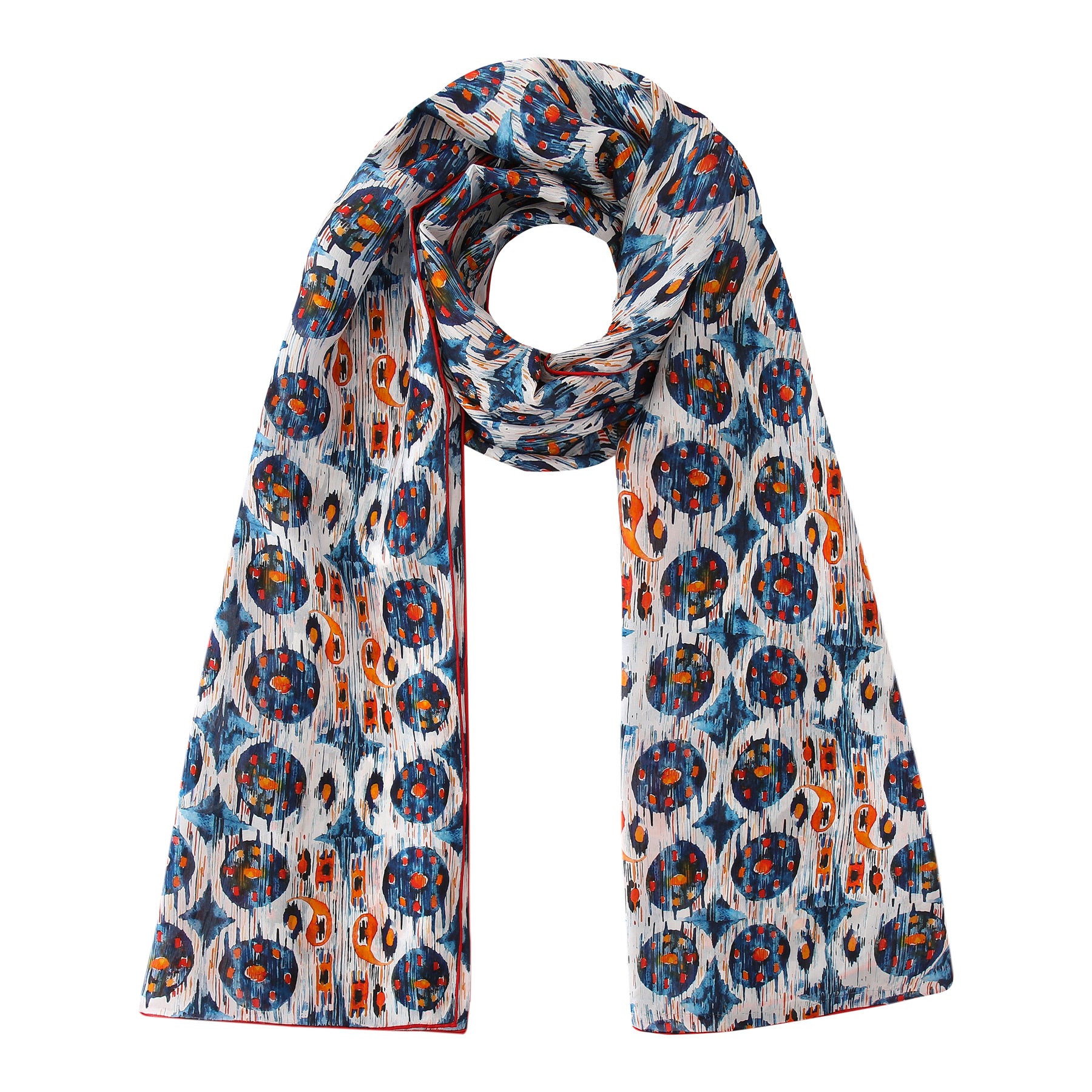 The White and Blue Habotai Silk Scarf Ikat Print is a lightweight silk scarf with a white base, featuring blue, orange, and red circular patterns and abstract shapes, stylishly draped in a loose loop.