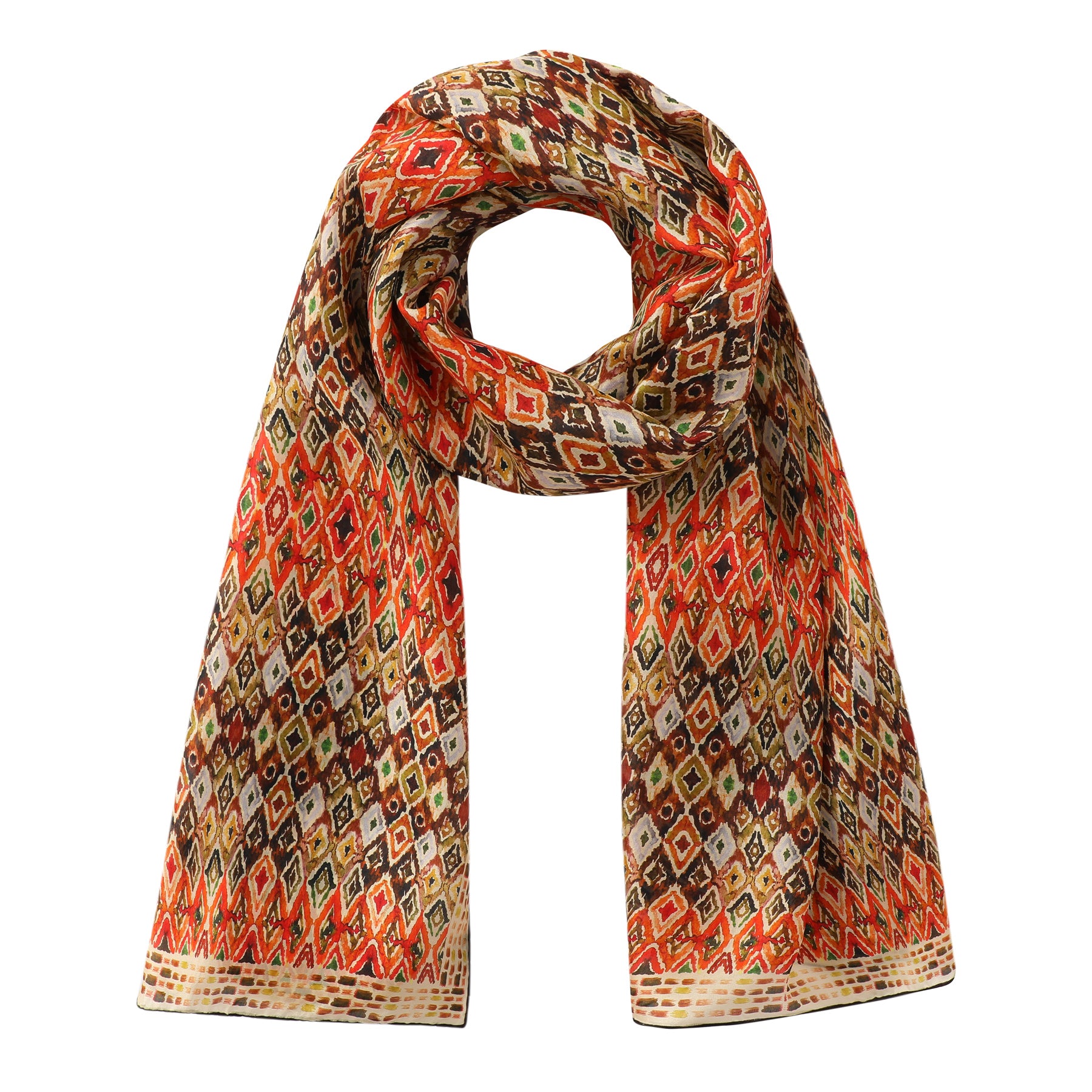 The Hamzah Multicolor Silk Scarf features an Ikat ethnic print with geometric diamond patterns in red, orange, brown, and cream on soft Habotai silk, elegantly draped in a loop against a white background.