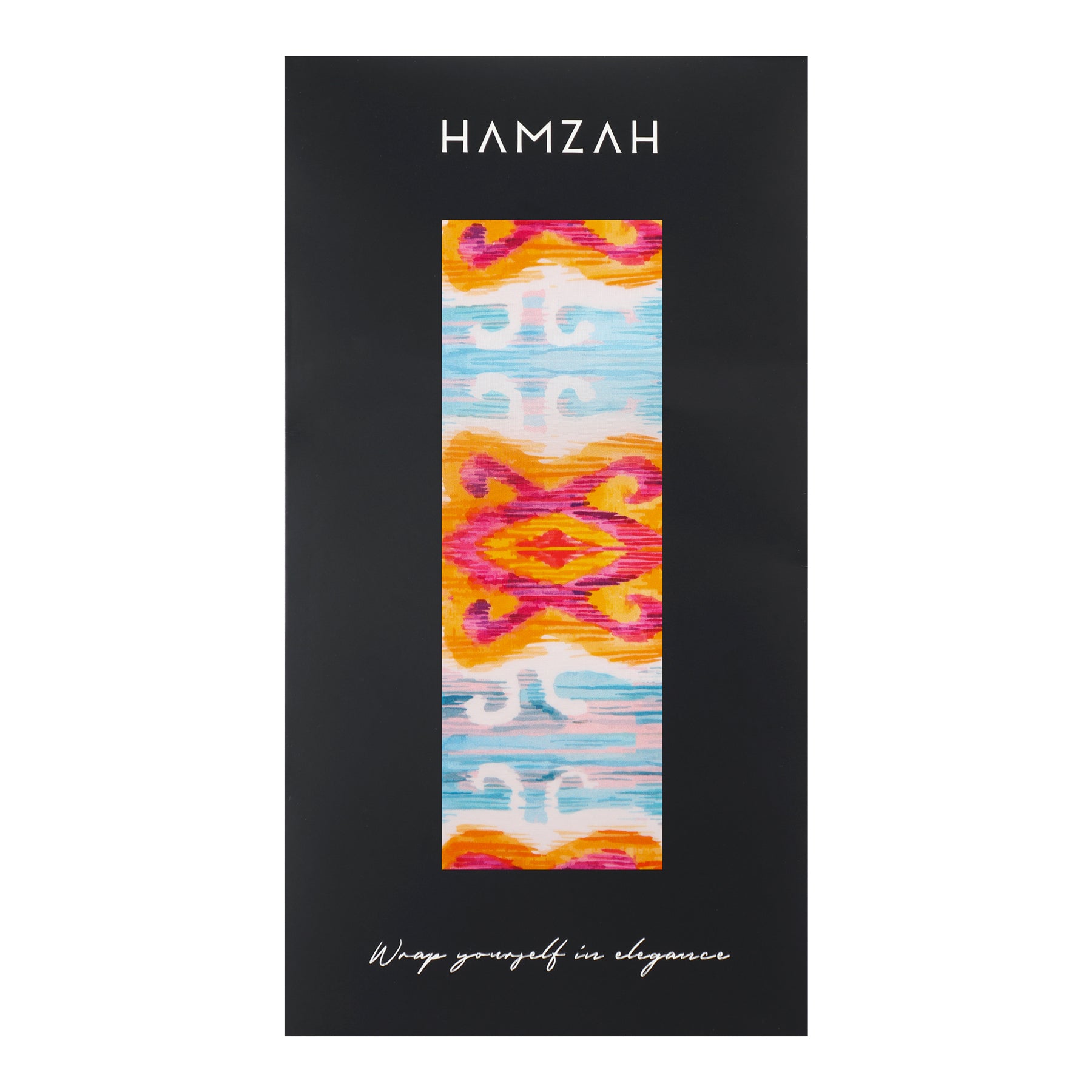 A black rectangular box labeled HAMZAH displays a Light Blue Silk Scarf with a vibrant Ikat Ethnic Print in pink, orange, blue, and white. Cursive text at the bottom says, Wrap yourself in elegance.