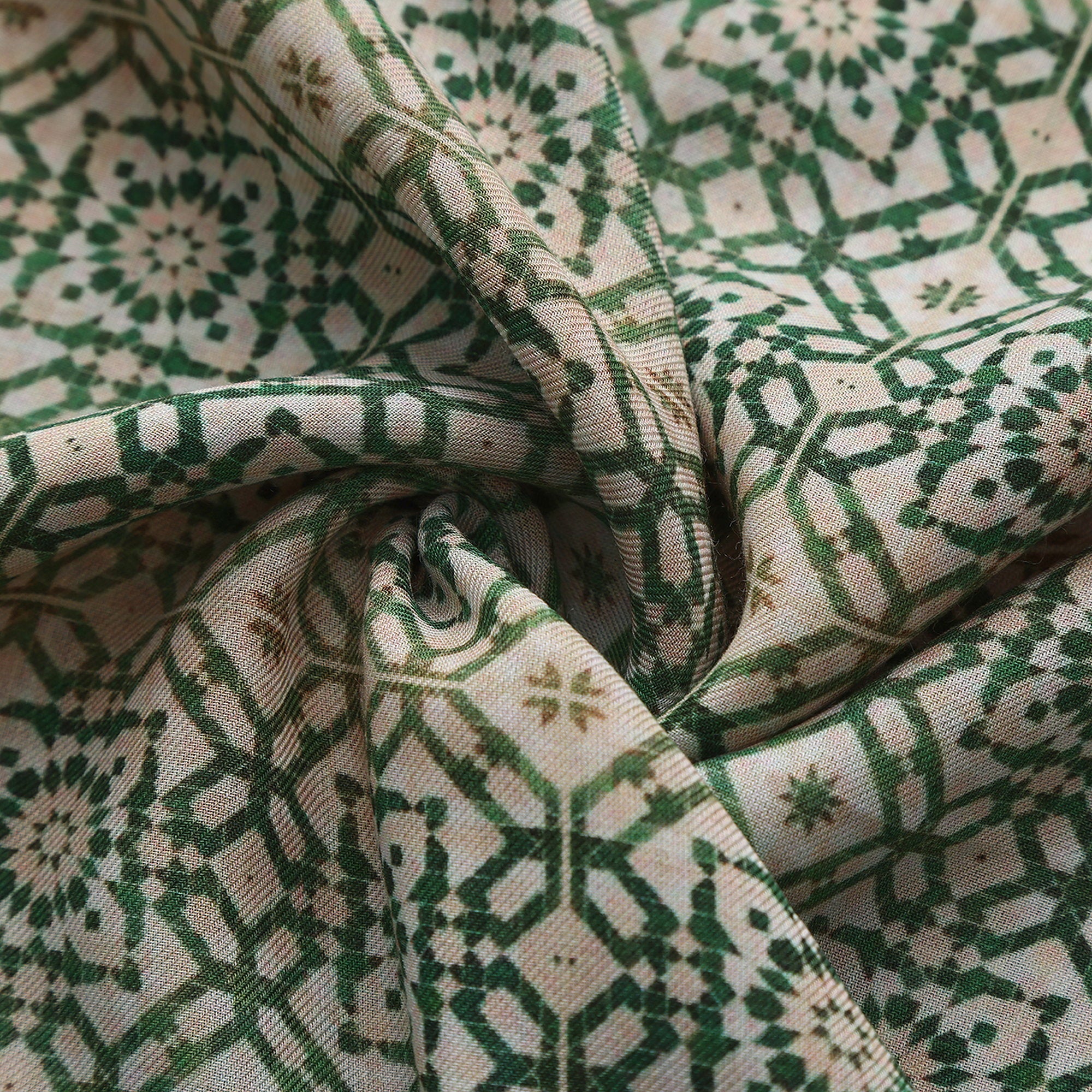 Close-up of the 054 modal print: the green lattice and the mustard and terracotta border