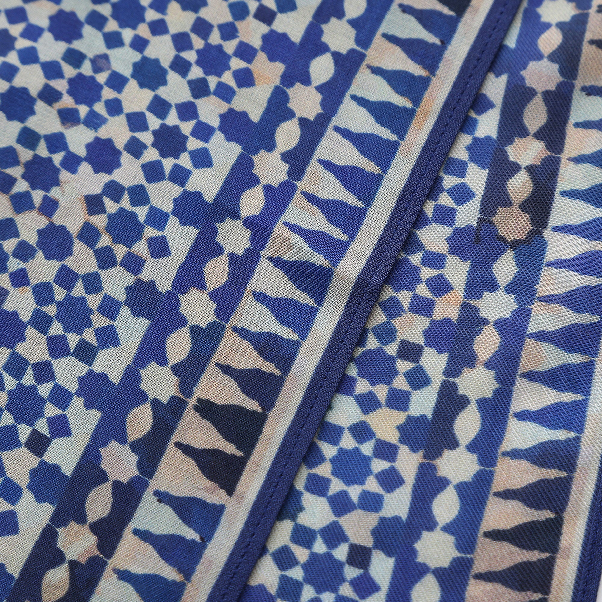 Corner of the Blue Modal Scarf Andalusian Tiles Almunia with the Hamzah woven label