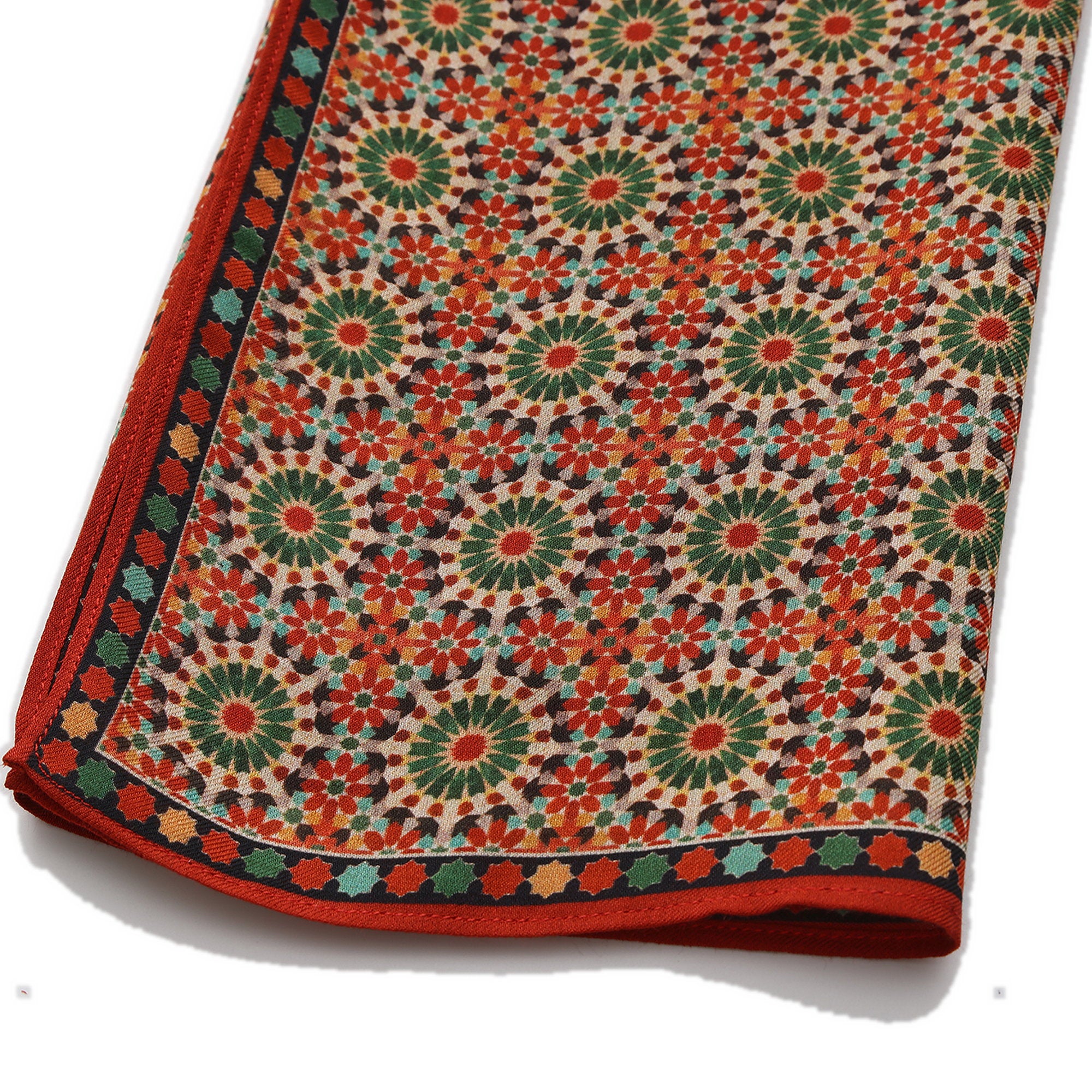 Corner of the Red and Green Modal Scarf Mosaic Rosettes Zubaida with the Hamzah woven label