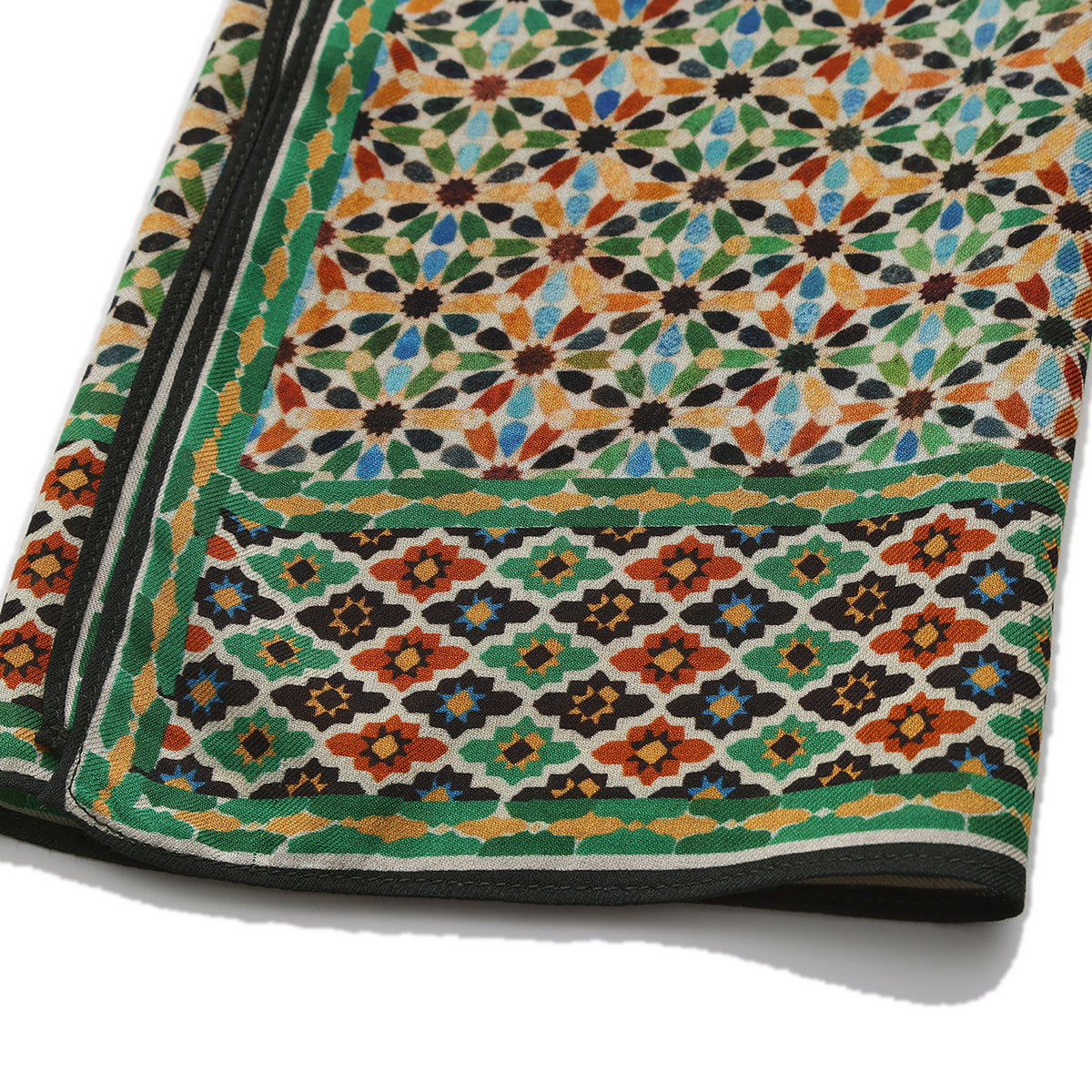 Folded corner of the Multicolor Modal Scarf Alhambra Stars Naima, showing the border and the hem