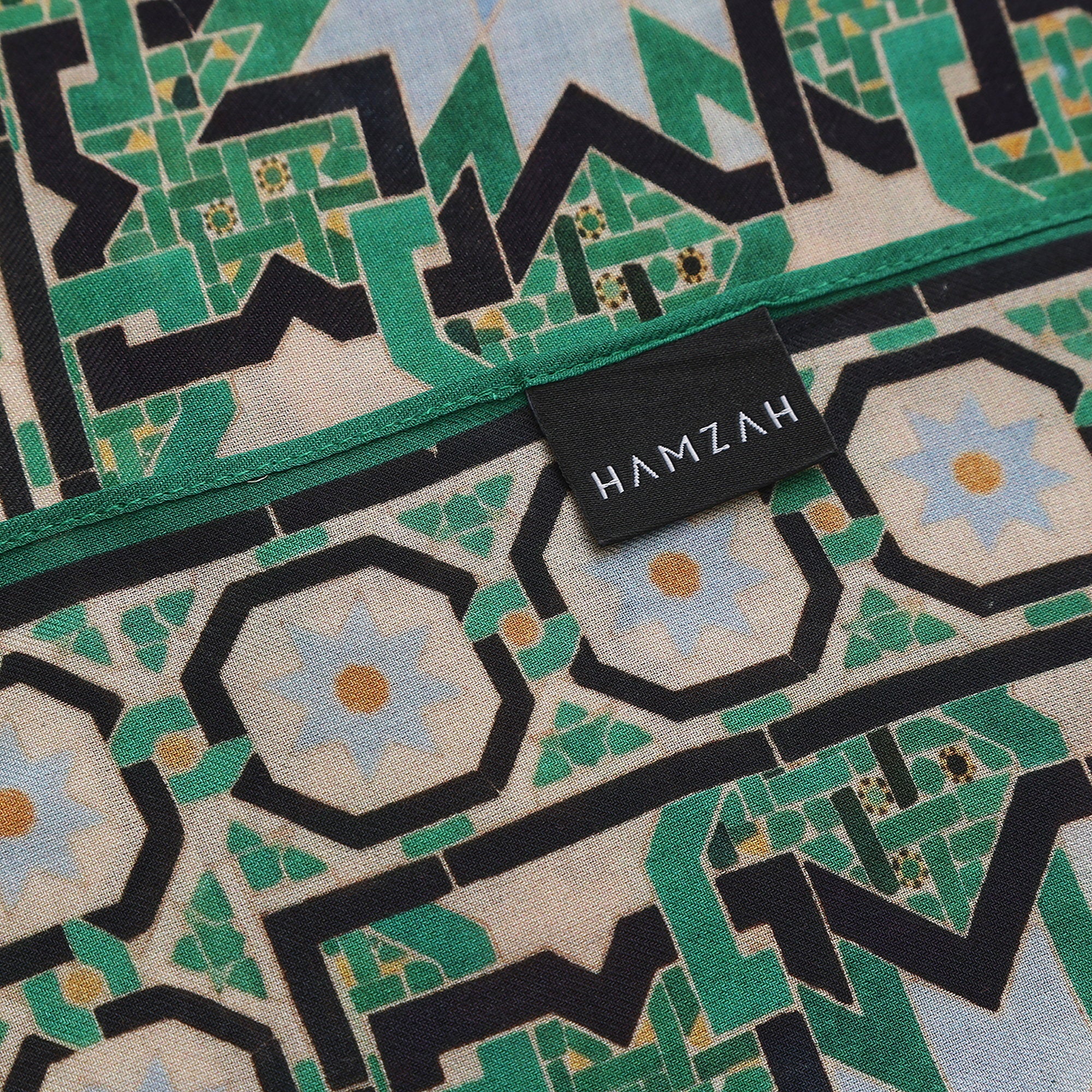 Corner of the Green Modal Scarf Alhambra Interlace Salma with the Hamzah woven label