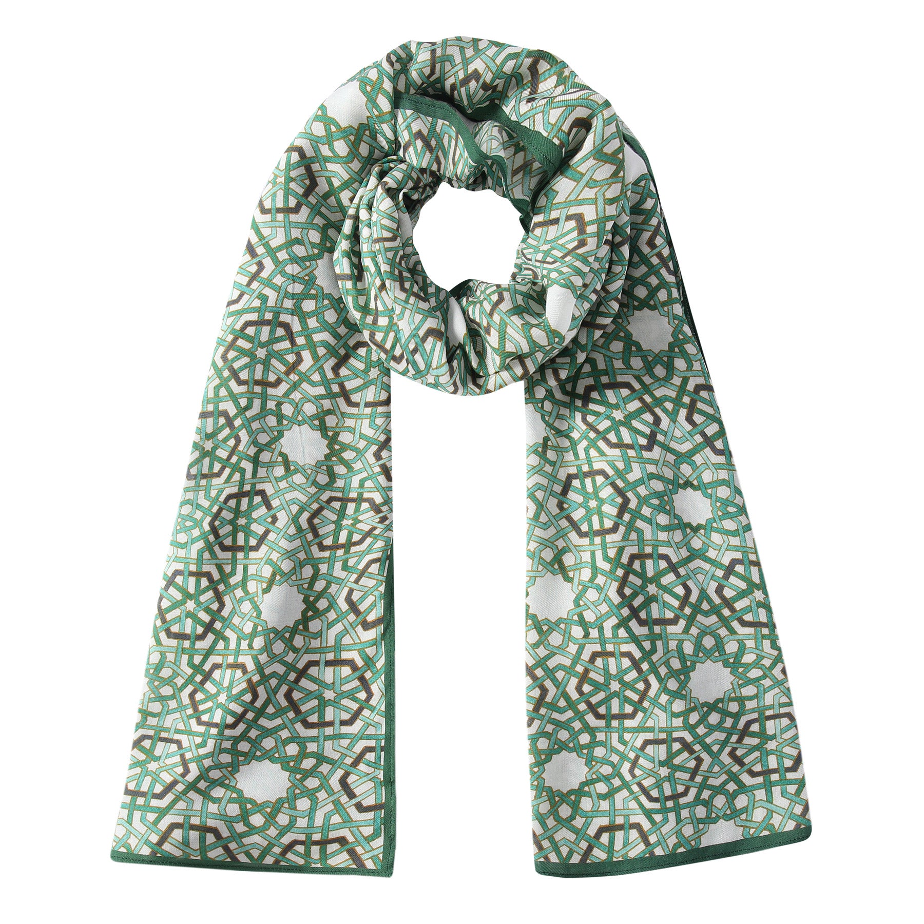 The Modal Hijab with Green Geometric Print features circular and grid patterns in green, brown, and white, inspired by Islamic art—perfect as a stylish hijab or chic accessory.