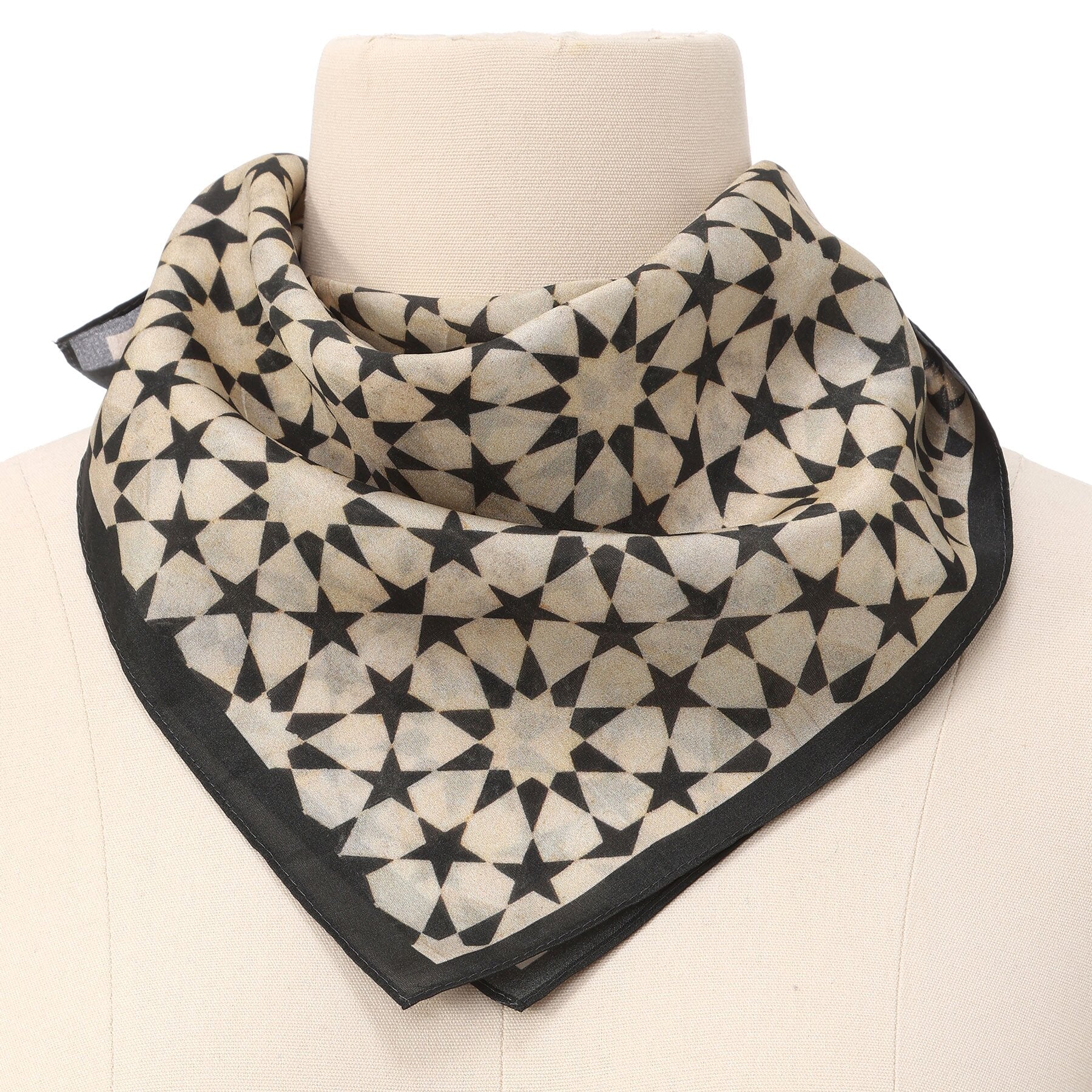 Black and Cream Silk Square Scarf Nujum tied at the neck on a mannequin bust