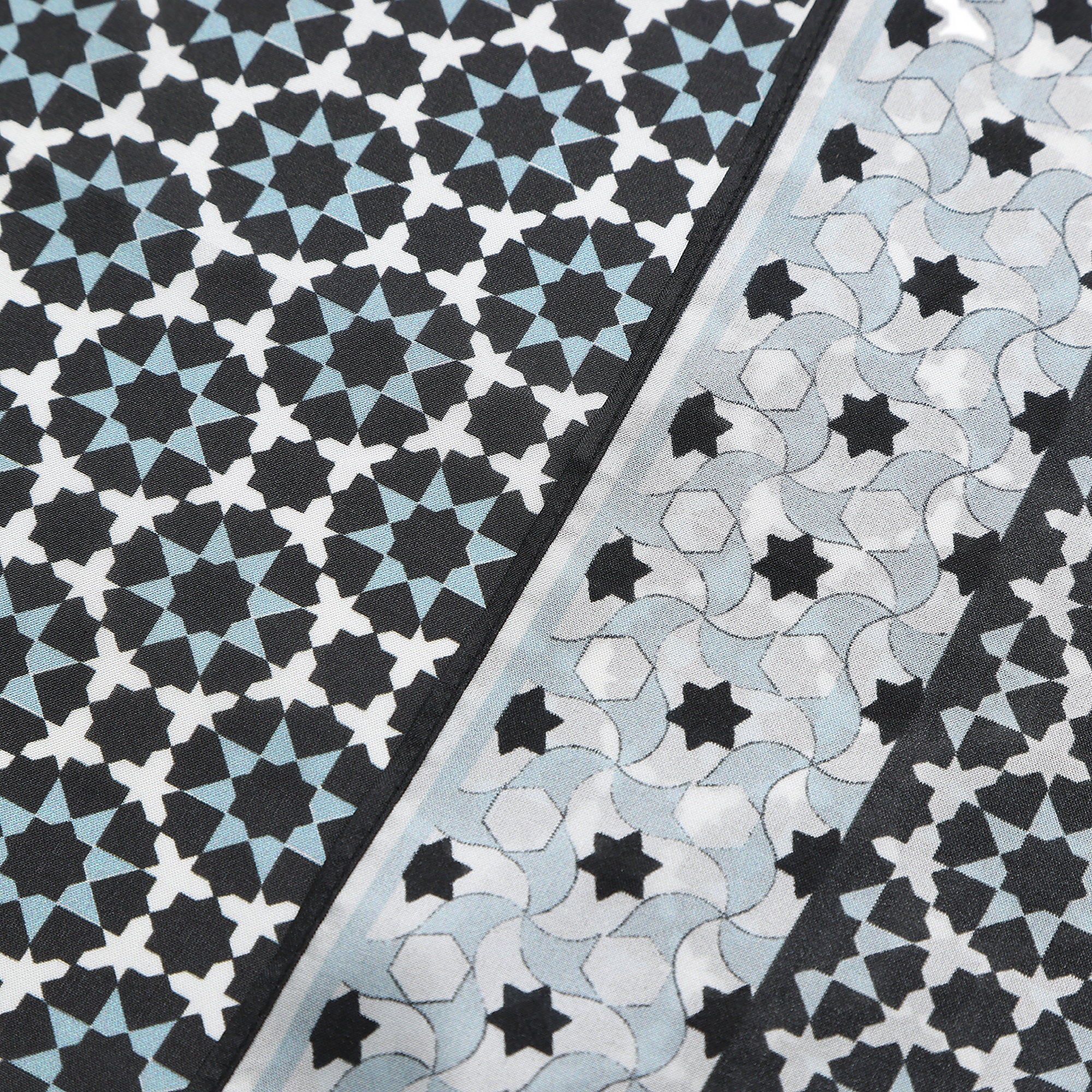 Folded corner of the Black and Grey Silk Square Scarf Zoraida, showing the border