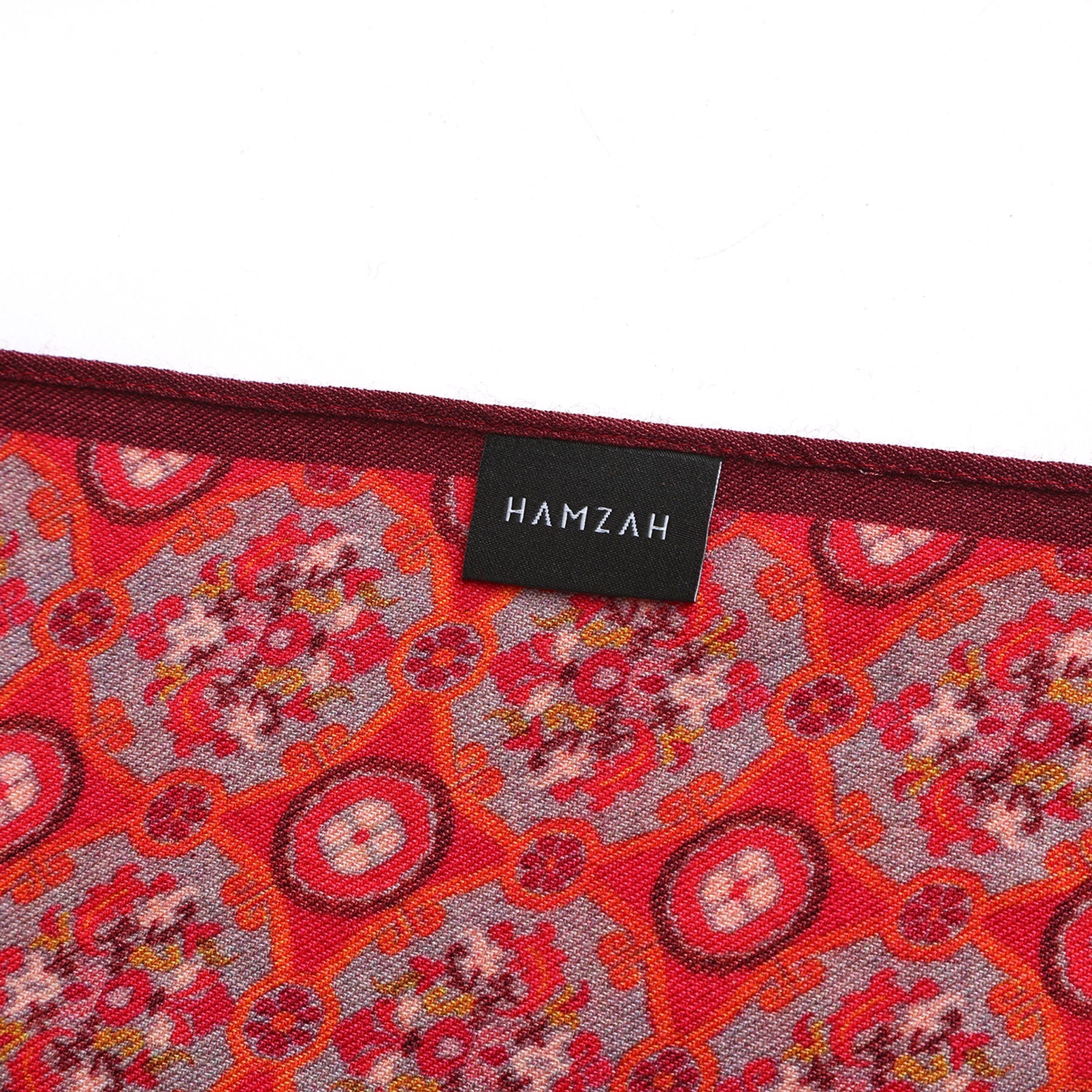 Close-up detail of Naum double-sided wool and silk scarf design