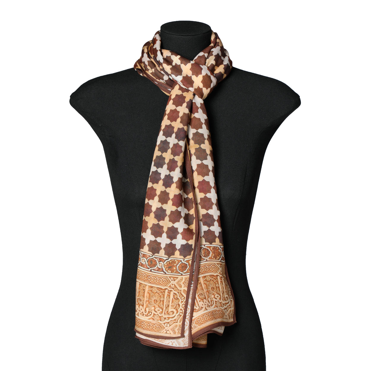The Brown Islamic Art-Inspired Modal Scarf Andalus, featuring beige geometric patterns and ornate borders, is draped around the neck of a black mannequin torso.