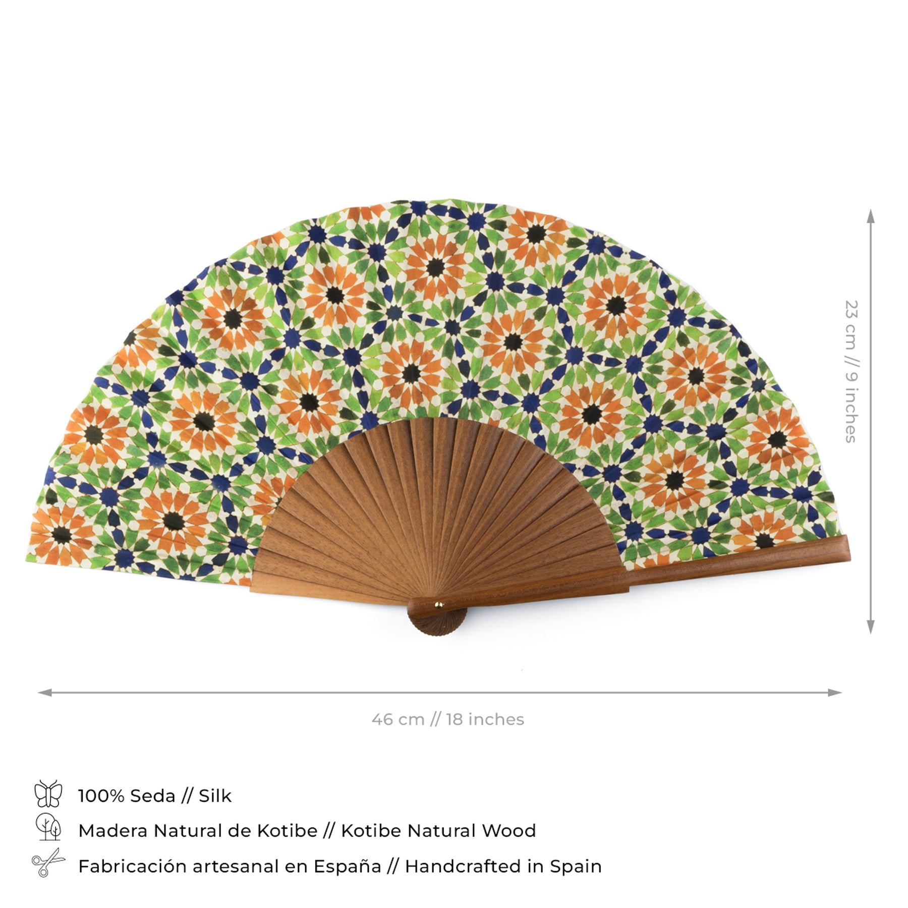 The Multicolored silk fan Nur showcases a floral geometric design inspired by Andalusian tiles in orange, green, and navy on natural silk, set in a wooden frame. Measures 46x23 cm. Crafted in Spain with quality materials.