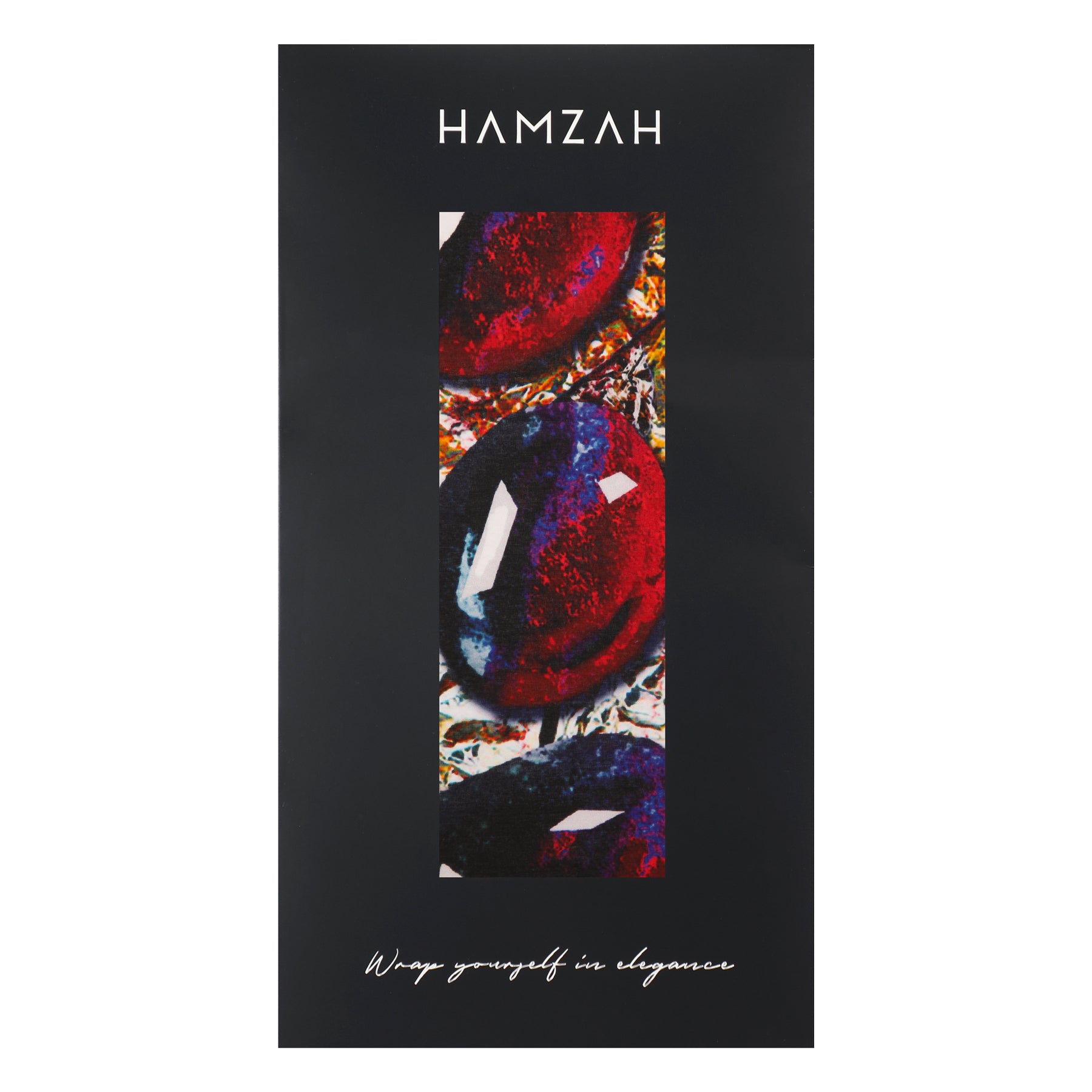 A black rectangular card with HAMZAH at the top, a vertical window showing the Habotai Silk Scarf Corazón de Granada’s
