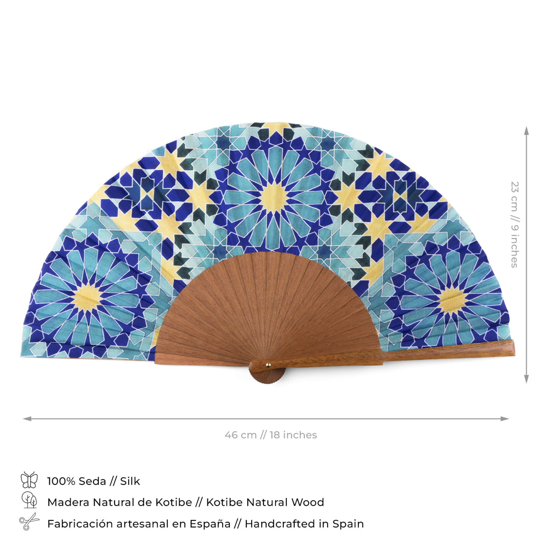 The Blue and Gold Silk Fan Secret Flower features a colorful geometric tile pattern in blue and teal, silk material, Kotibe wood base (46 x 23 cm), and is handcrafted in Spain with a hand painted design by Sandy Kurt.