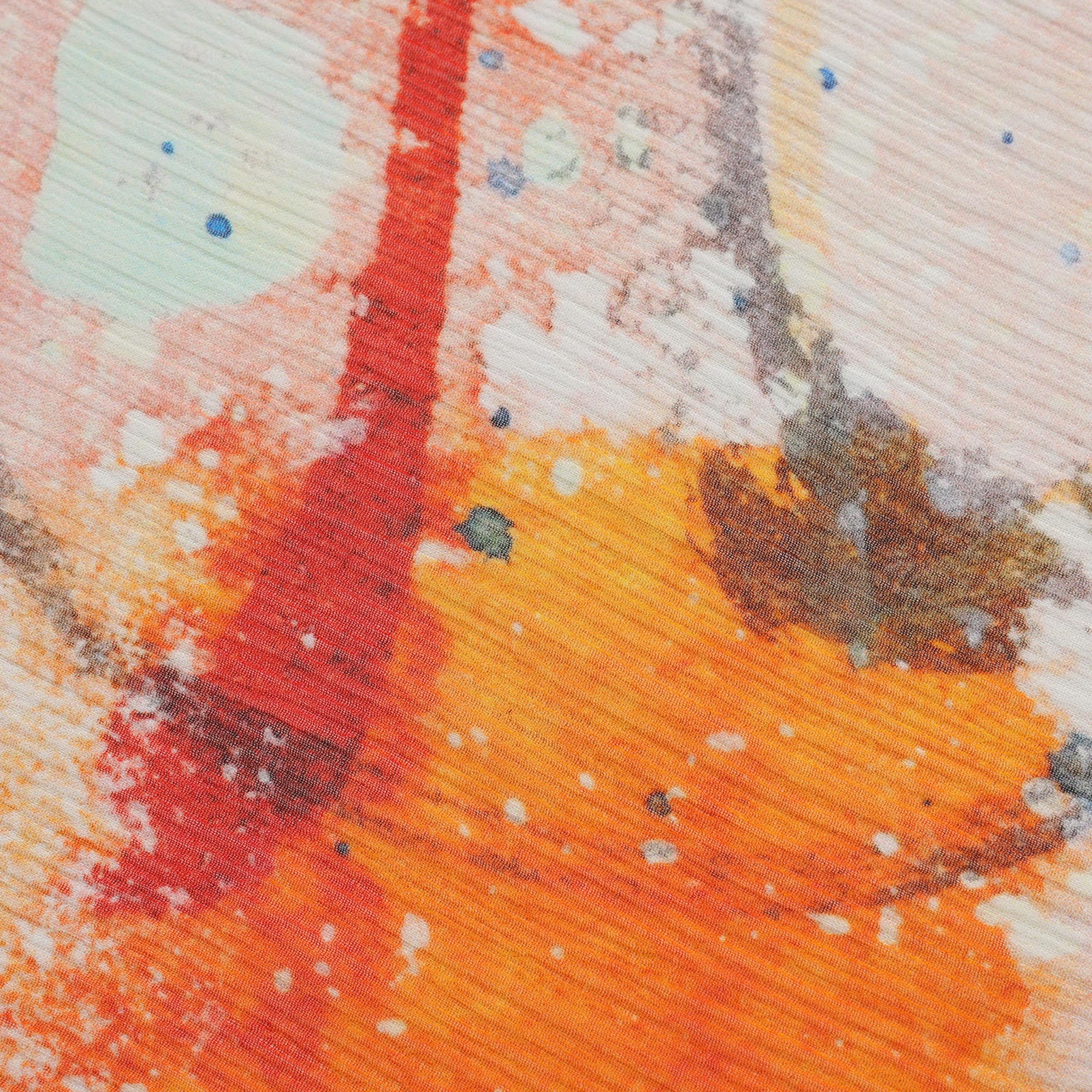 Close-up of Multicolor Silk Scarf Cangrejos: abstract orange, red, and brown brushstrokes, splattered with white and blue—perfect as a Mediterranean-inspired wearable artwork in muslin silk with a textured, layered appearance.