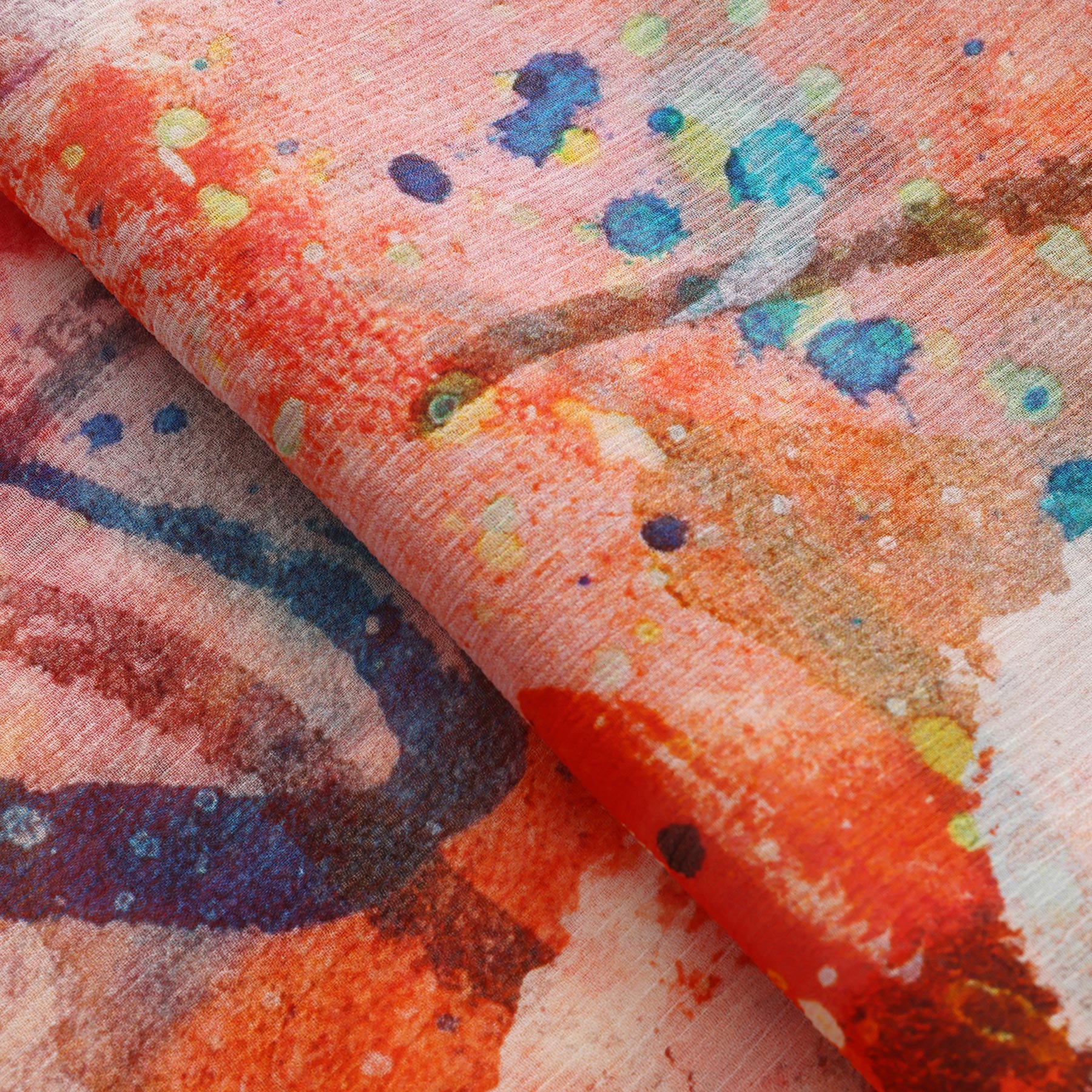 Close-up of the Multicolor Silk Scarf Cangrejos, crafted from muslin silk with an abstract, watercolor-like pattern in red, orange, blue, yellow, and green—a vibrant piece of wearable art.