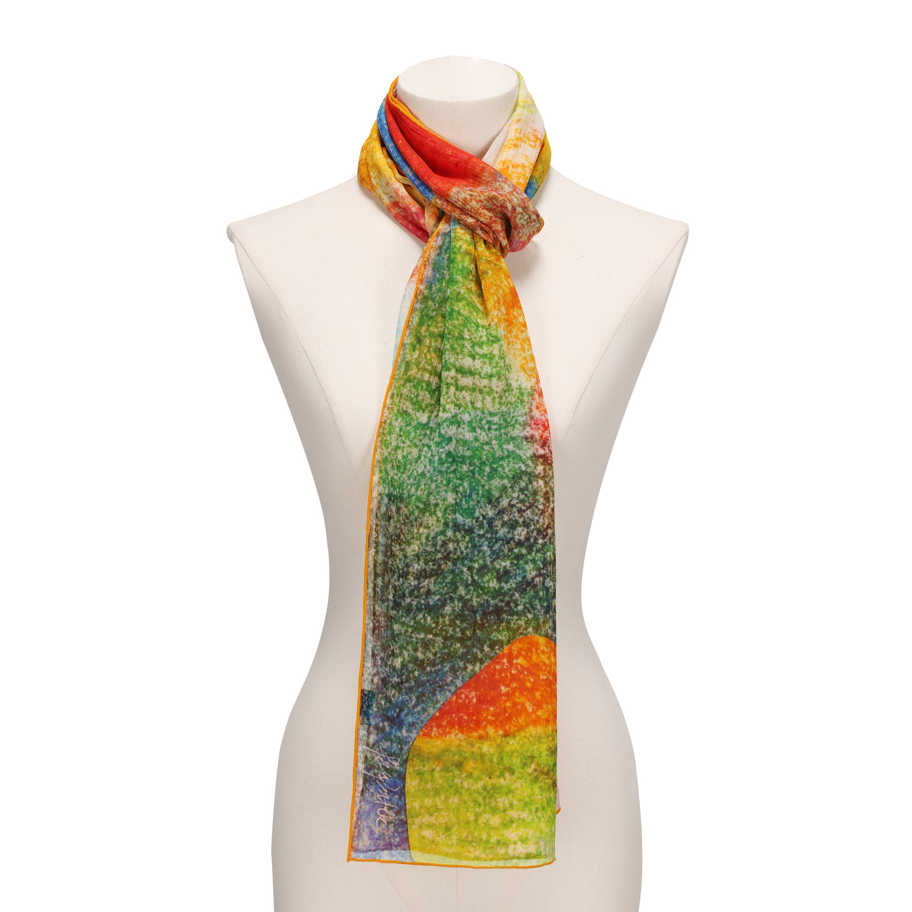 A white mannequin showcases the Multicolor Silk Scarf Calidoscopic—wearable art in muslin silk, featuring an abstract, textured pattern with vibrant red, orange, yellow, green, and blue hues tied elegantly around the neck.