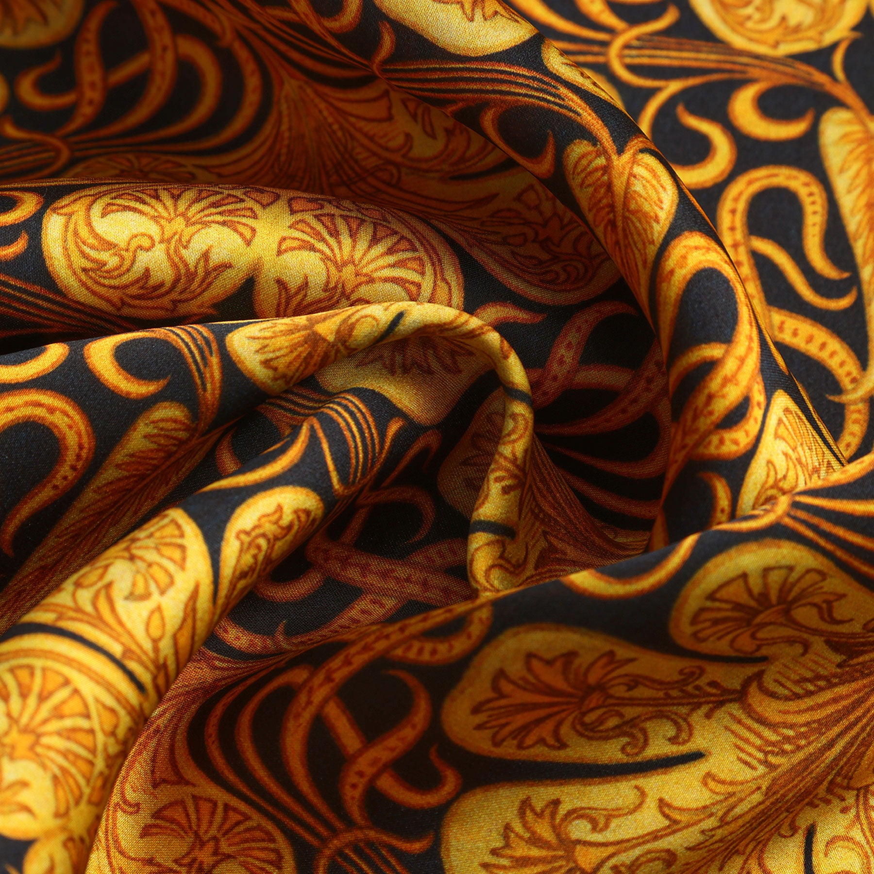 A black rectangular package labeled HAMZAH, featuring a central ornate gold batik design inspired by art nouveau, houses