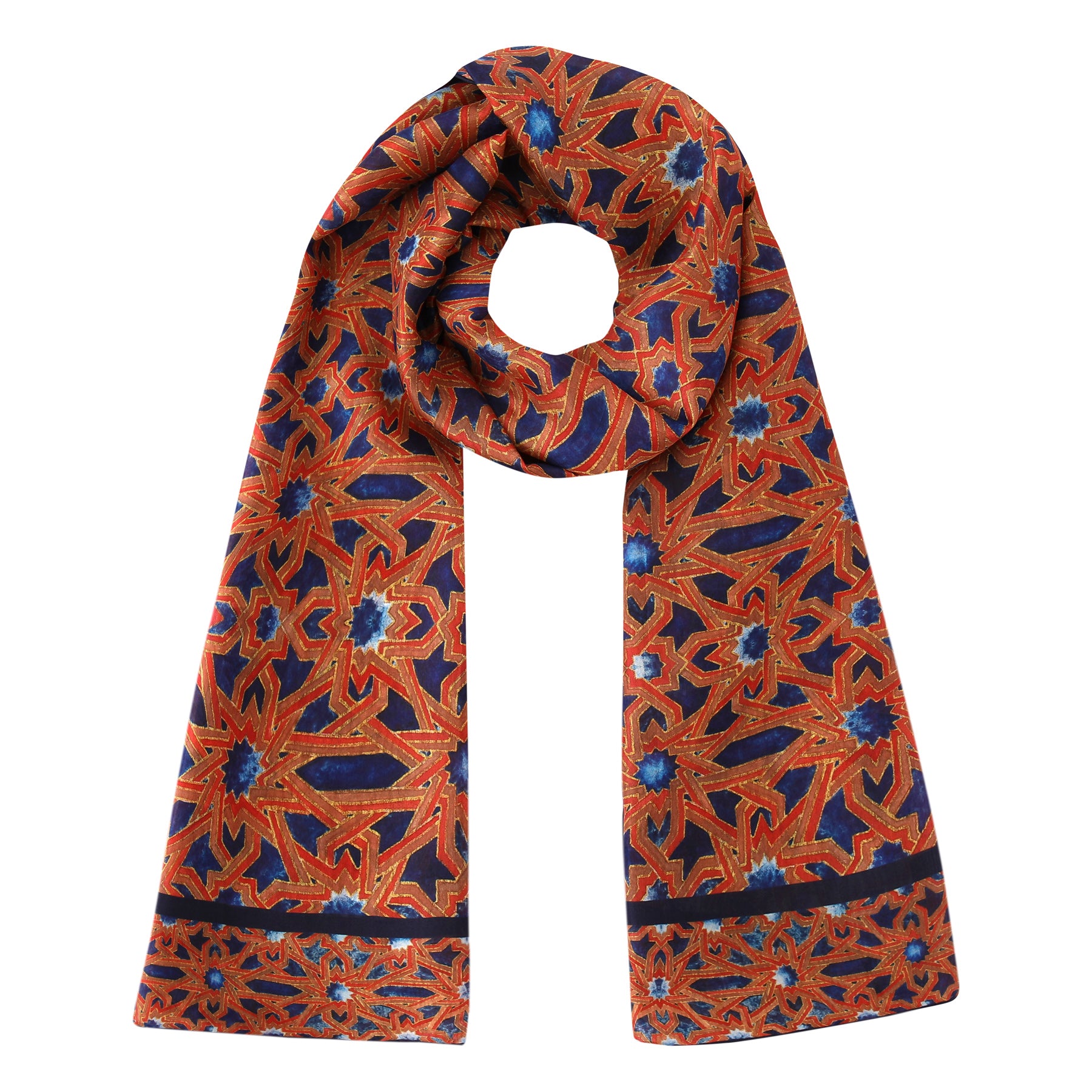 The Islamic Art Silk Scarf Alcázar Genil features intricate watercolor geometric designs inspired by Andalusian art in red, orange, blue, and gold, shown laid flat with one end looped in a circular shape.