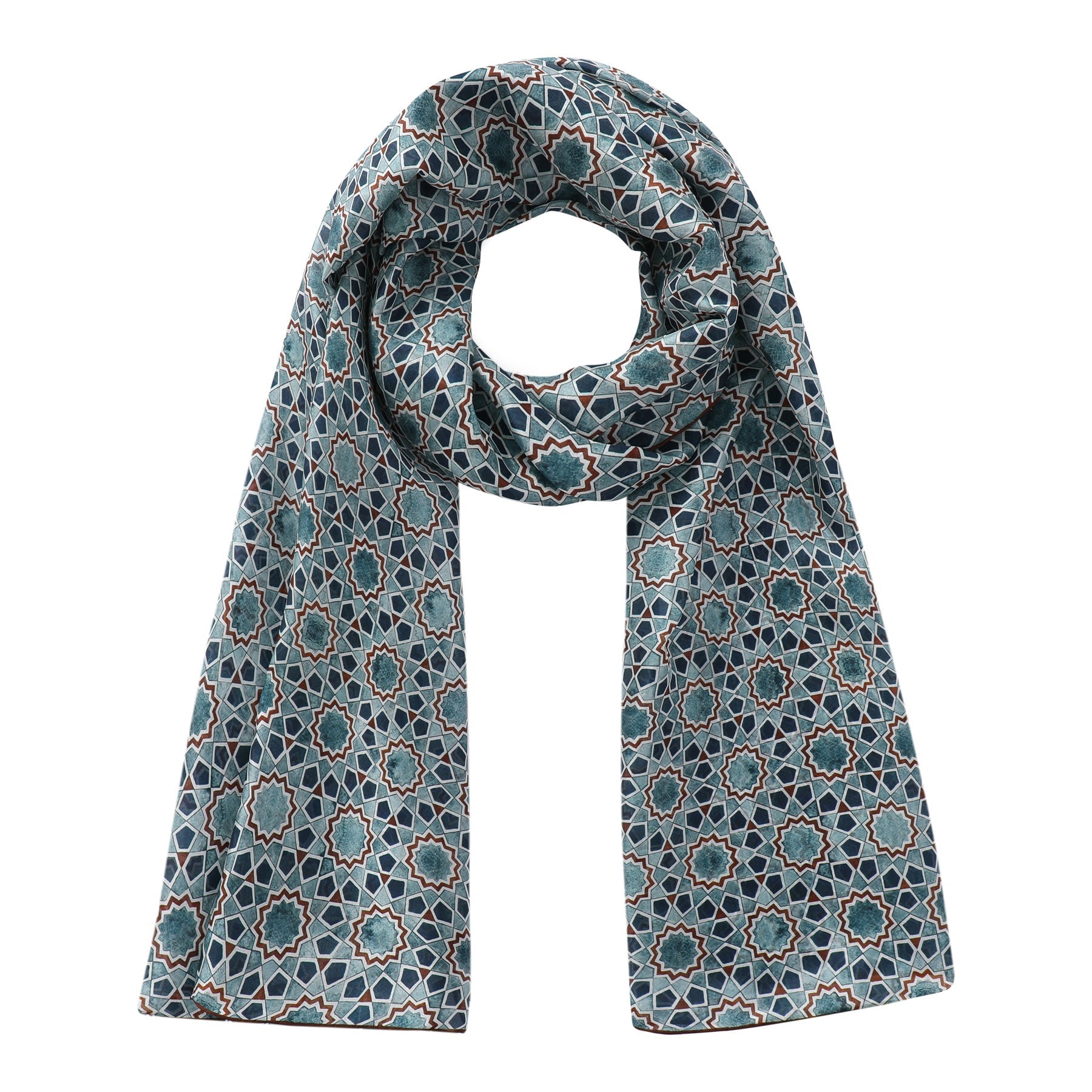 The Islamic Art Design Silk Scarf Rihla V1 by Hamzah is a neatly folded silk scarf featuring a symmetrical geometric pattern in teal, navy, and beige with star-like shapes. Inspired by Islamic art, it boasts an intricate repeating motif for a sophisticated and stylish look.