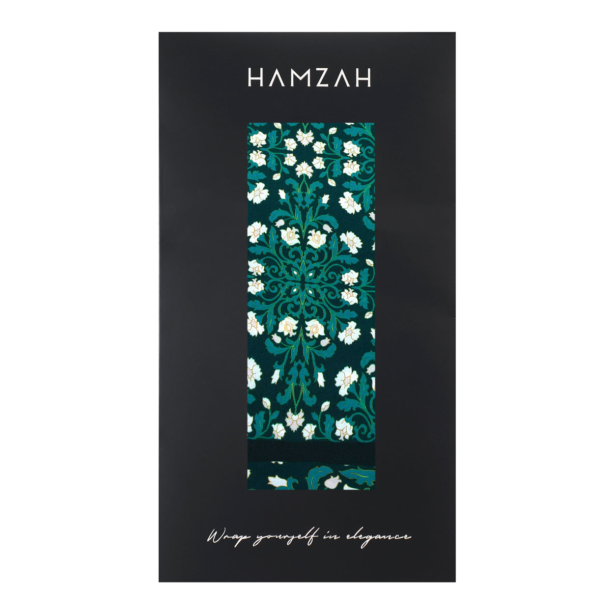 The Floral Green Silk Scarf with Delicate White Blooms comes in elegant black packaging labeled HAMZAH at the top and “Wrap yourself in elegance” at the bottom—ideal for adding a touch of refined style.