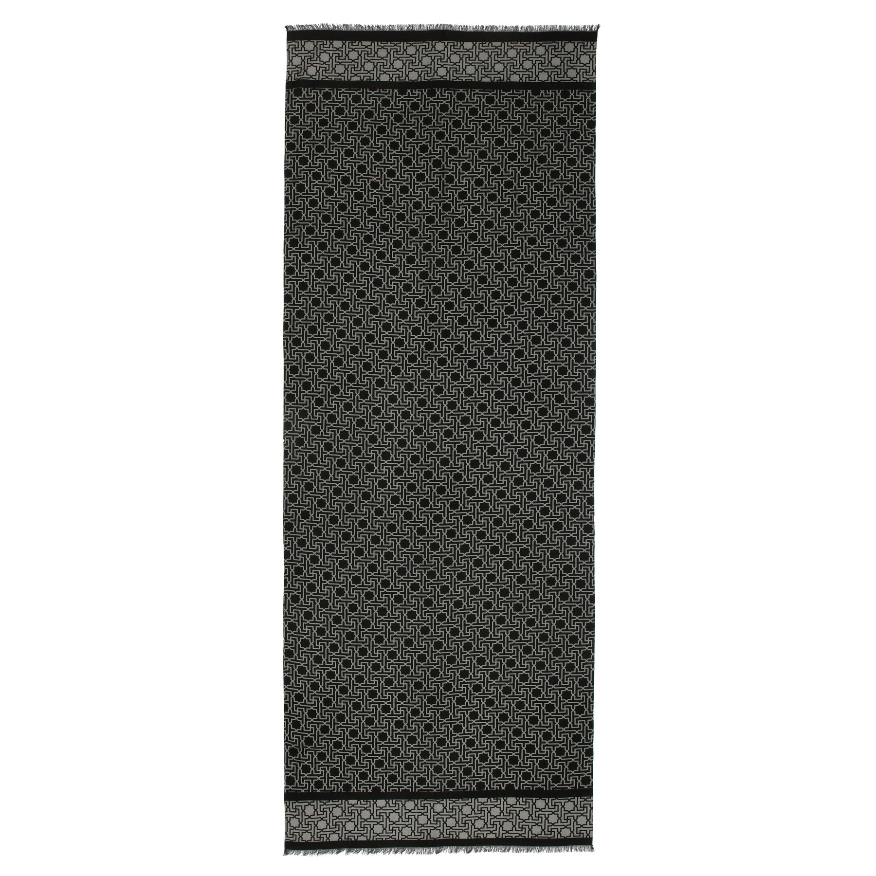 The Silk Wool Black and Gray Scarf Rawdah V1 features an intricate white Islamic geometry-inspired print on a long, rectangular black base, crafted from silk and wool with two horizontal patterned bands and short fringe at each end.