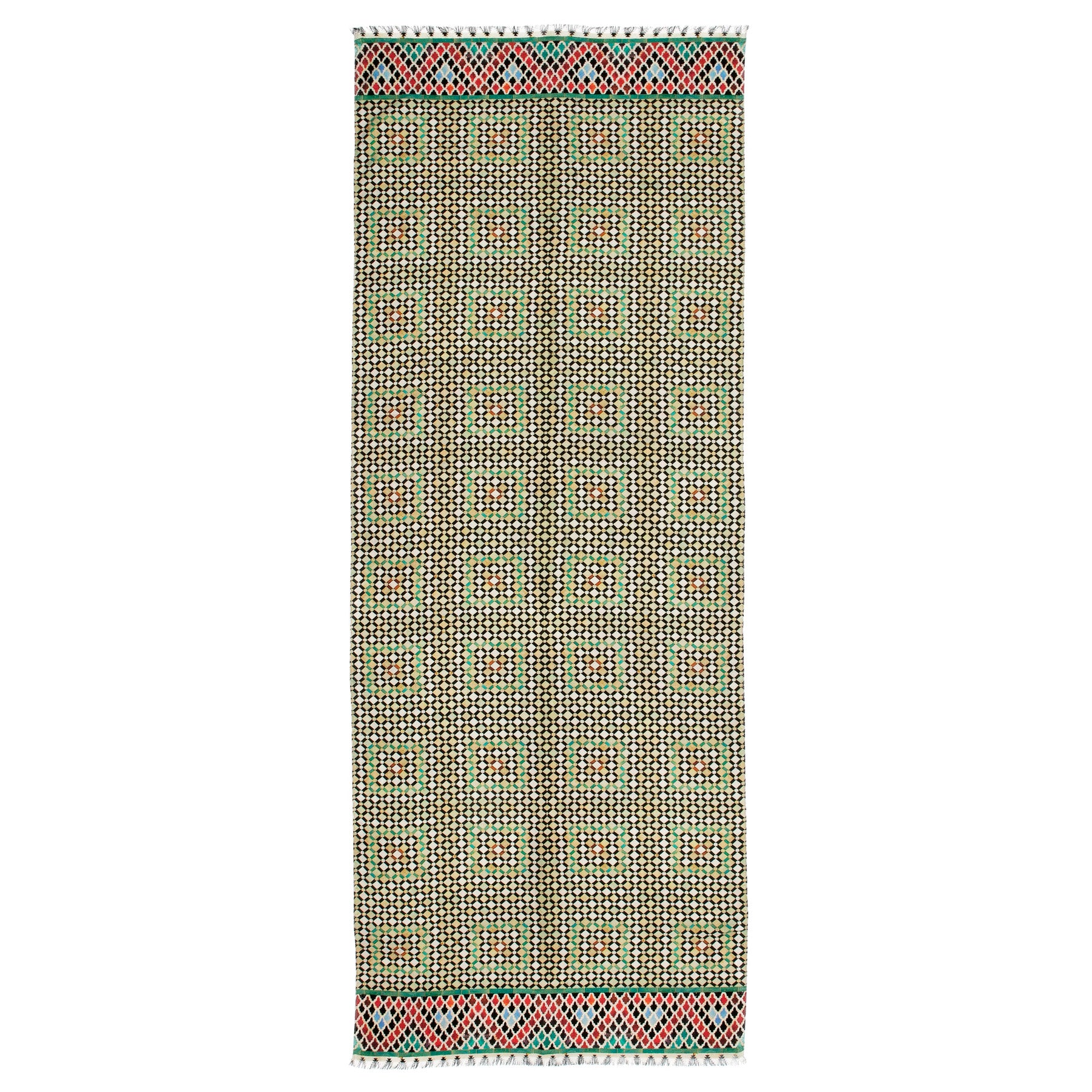 The Silk and Wool Scarf Hub is inspired by Islamic Art, featuring a geometric black, yellow, and green pattern with red and light blue accents along the edges and fringed ends.